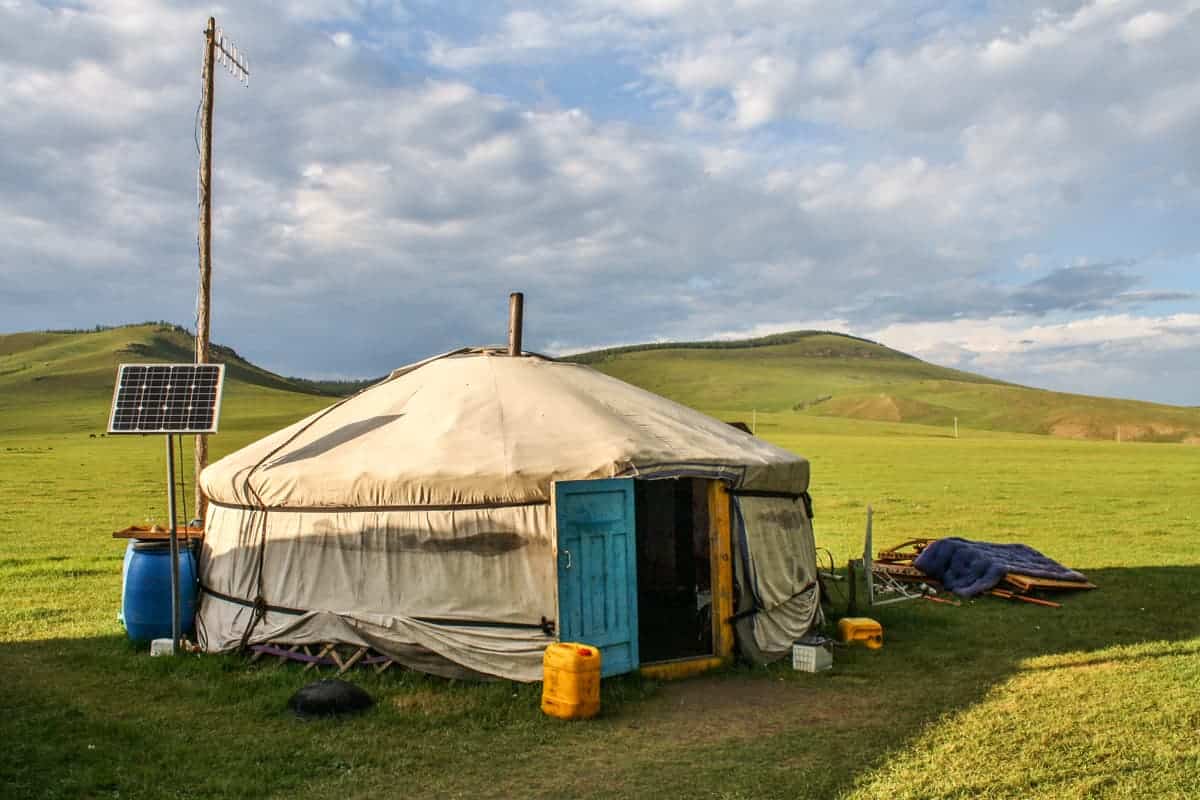 The layers of materials used to build a ger in Mongolia including felt and wood