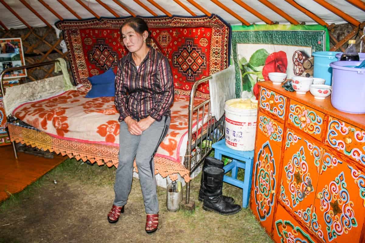 Mongolian woman inside a ger which has segregated areas for males, females and guests
