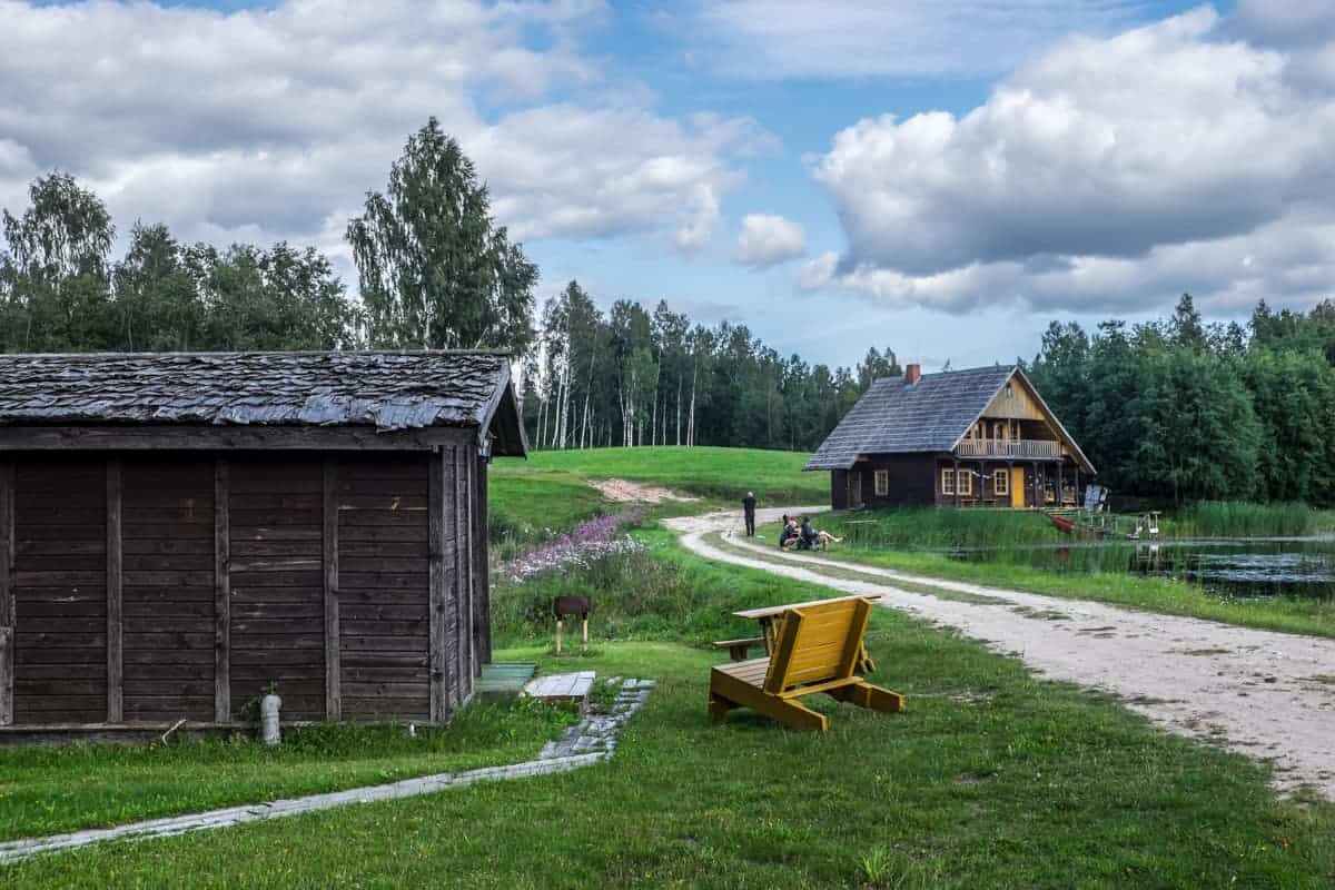 A typical campsite with wooden huts in the forest green in Gauja National Park Latvia