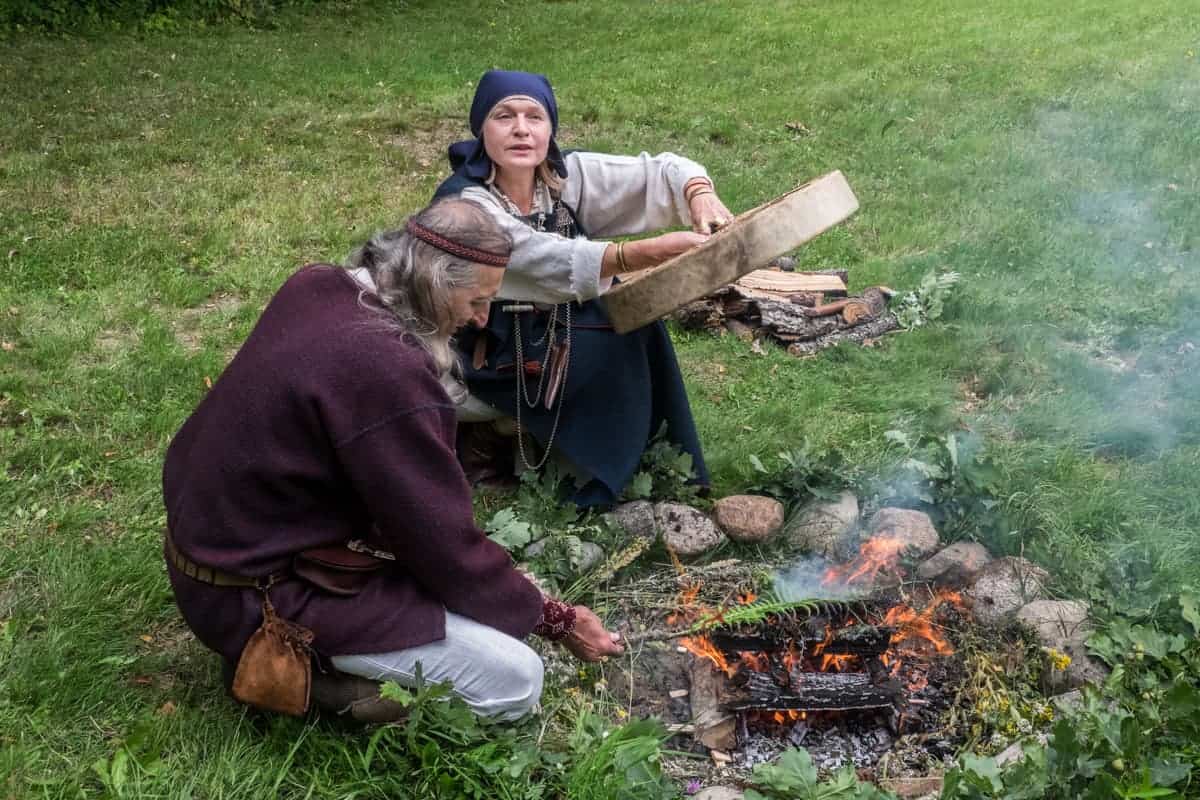 Nature healers explaining the traditions behind the Latvian fire ritual in Gauja National Park