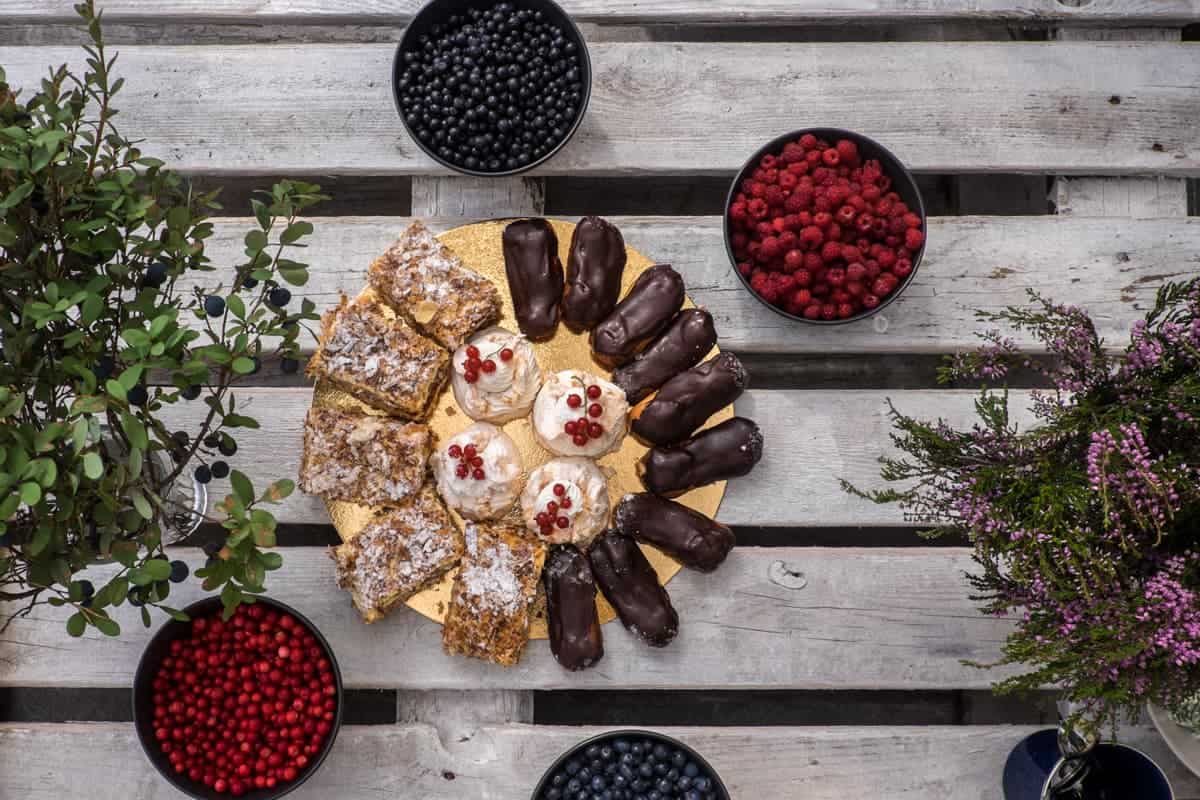 Cakes and freshly picked blue and red berries served up in Ergli, Latvia 