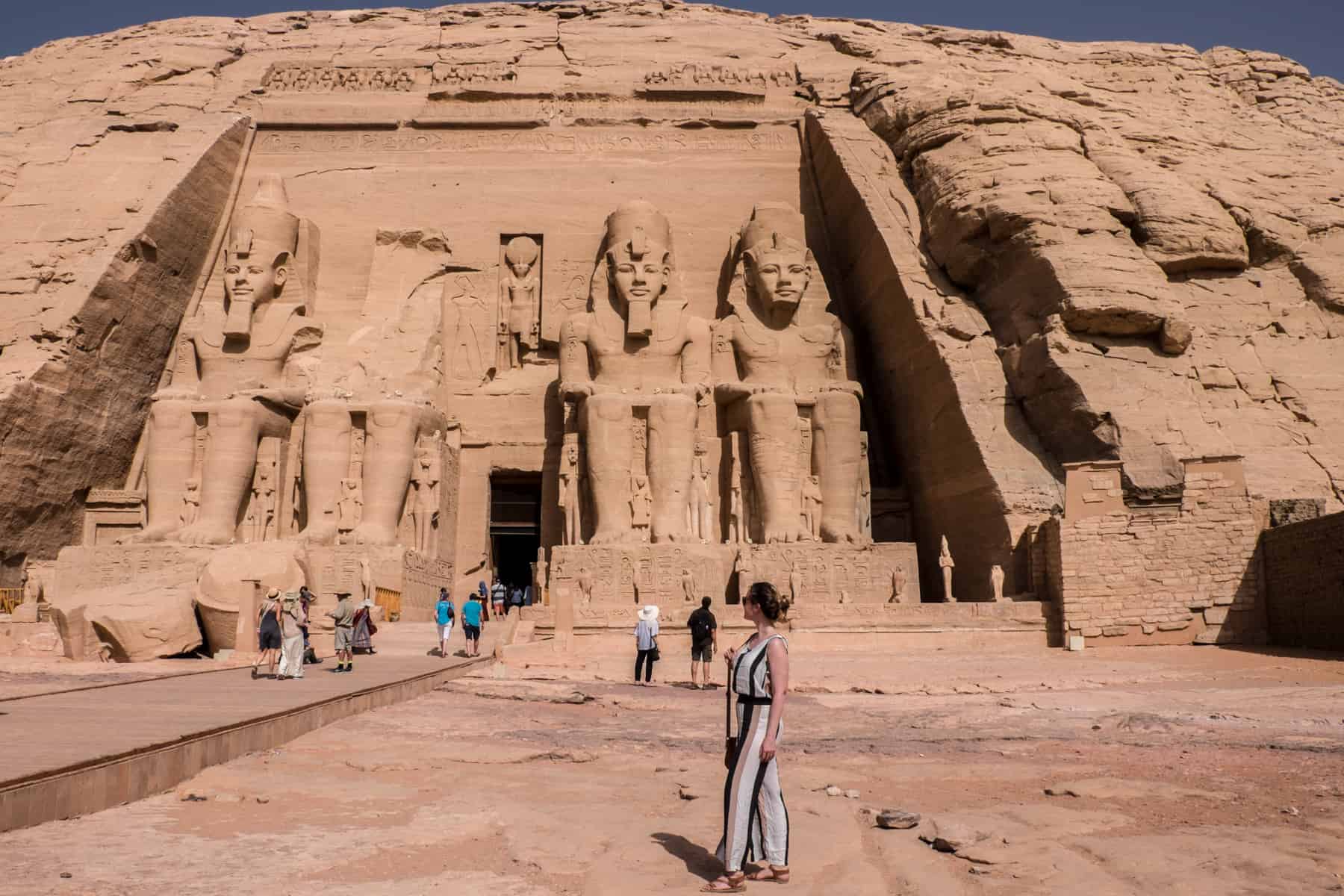 The main mountain carved temple of Abu Simbel dedicated to Ramesses II whose colossal statues line the entrance