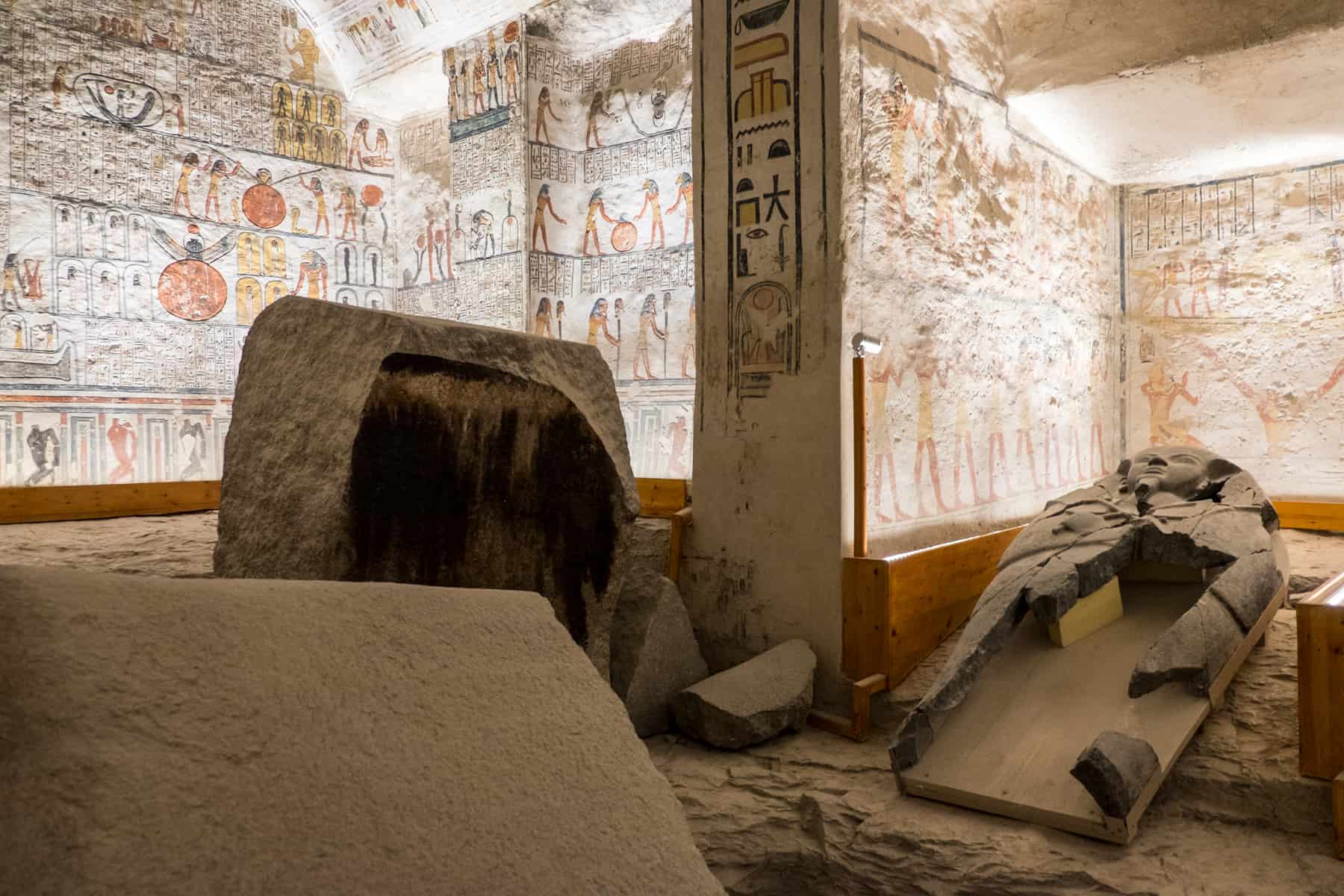 Inside the tomb of Ramesses IV in the Valley of the Kings, Luxor Egypt where you will see the broken stone coffin and every wall painted with colourful picture stories