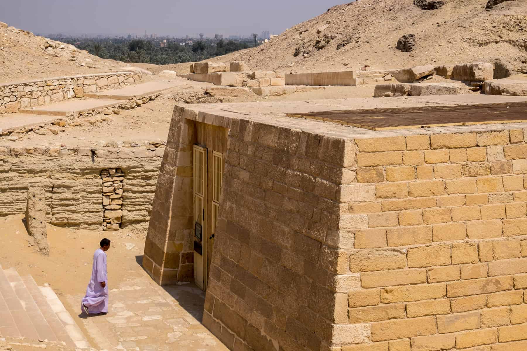 An Egyptian guide enters one of the recently excavated New Tombs at the site of Saqqara in Egypt