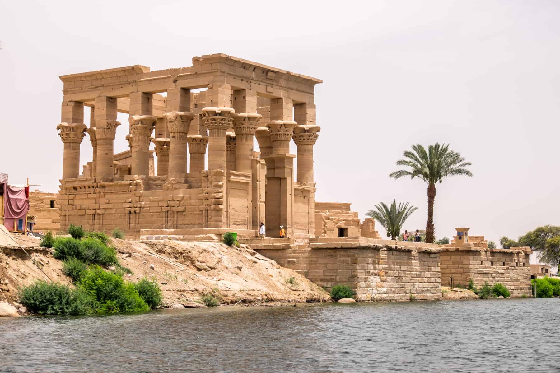 The Greek style column architecture of Philae Temple in Aswan, Egypt as seen from the river you need to cross to access it
