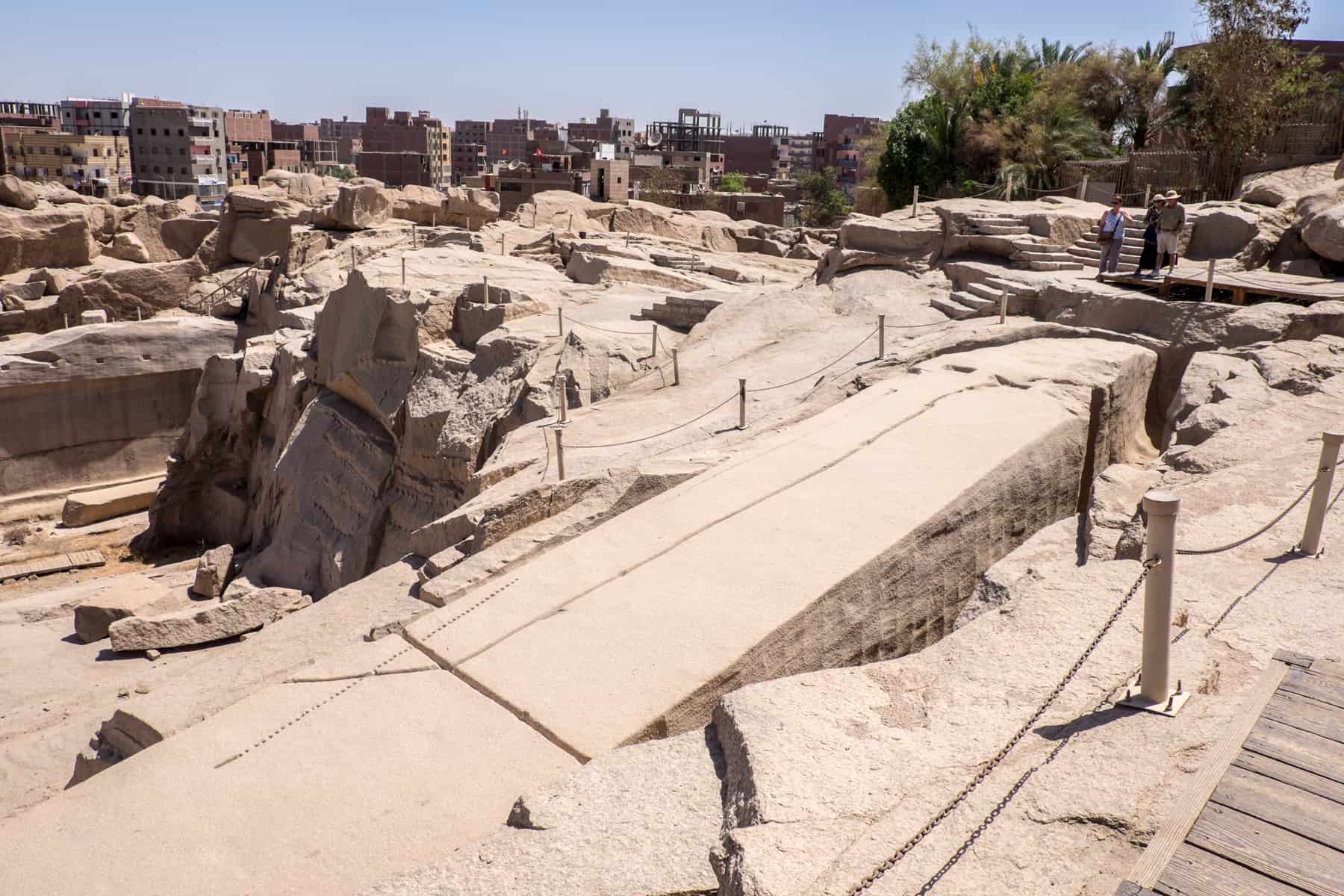 The long, carved structure of the Unfinished Obelisk in Aswan Egypt, named for the fact that the huge crack running through it halted its completion