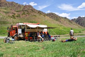 A small group set up camp from their overland truck in Orkhon Valley Mongolia