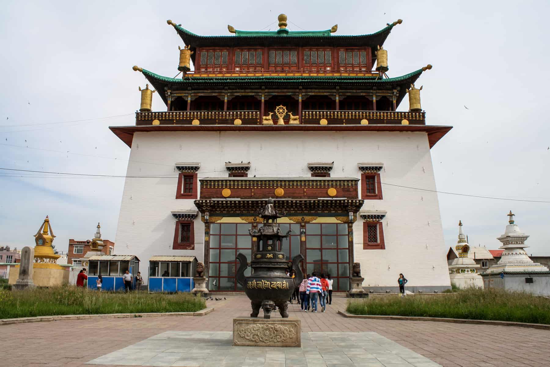 The red and gold roofed white temple building of the Gandan Monastery in Ulaanbaatar, Mongolia