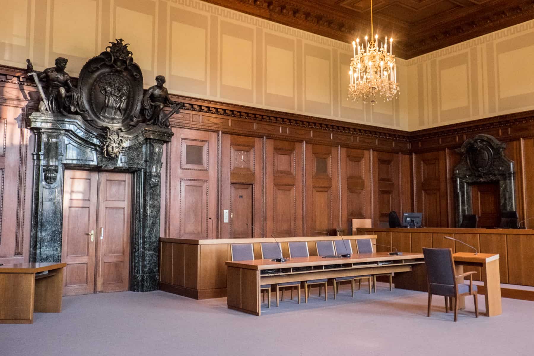 The dark wood clad interior and hearing bench inside Courtroom 600, where the Nuremberg Trials took place