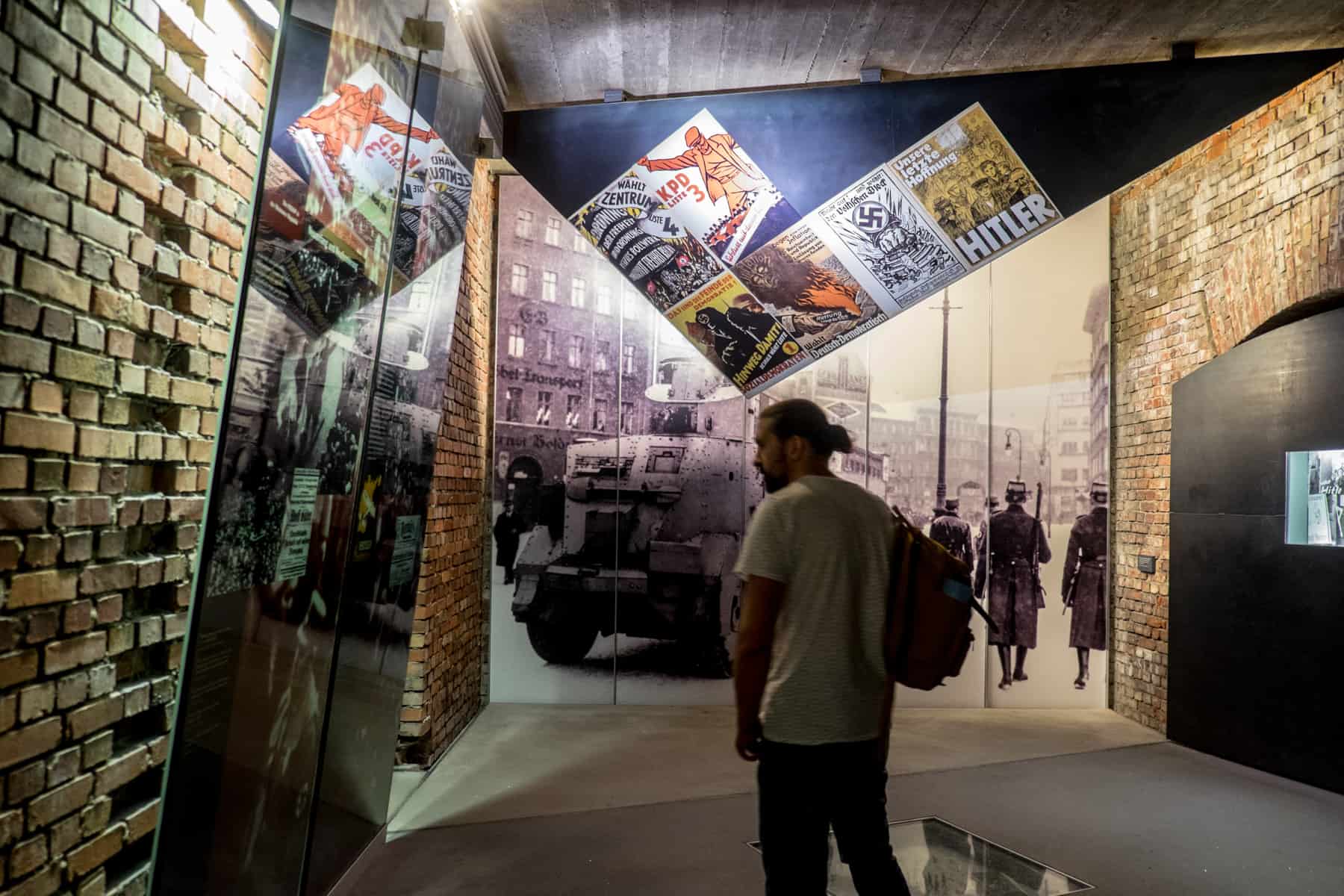 A man inside the Nuremberg Documentation Centre looking at the displays of the 'Fascination and Terror' exhibition