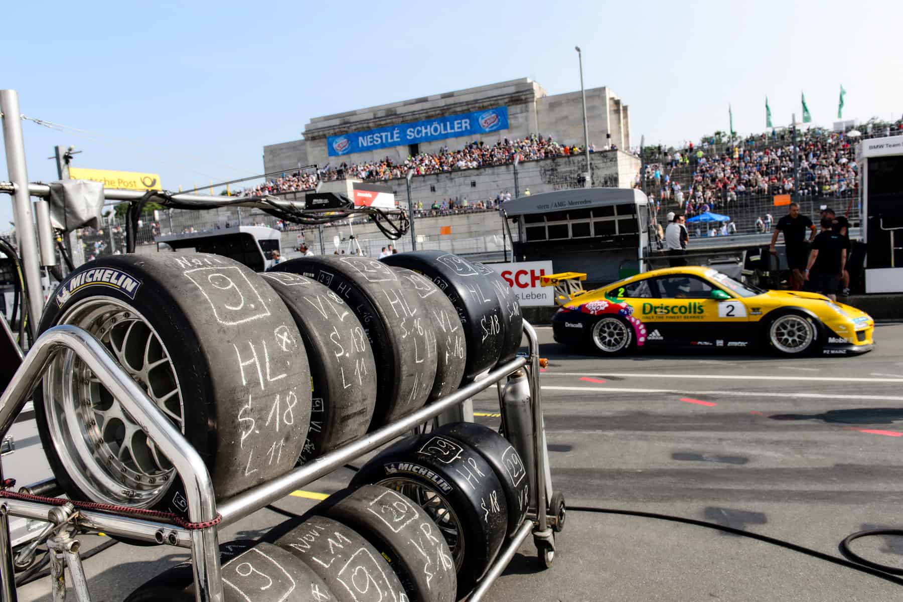 Car tyres stacked in front of the racing track of the Norisring racing event in Nuremberg that takes place on the Nazi Rally Grounds Zeppelin Field