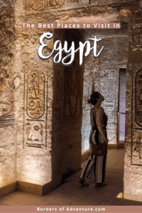 A woman stands in the doorway of an Ancient Egyptian temple, covered in carvings and a golden glow