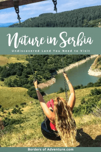 A woman wearing red on a tyre swing with a wooden beam, overlooking the winding, turquoise waters of Uvac Gorge in Serbia