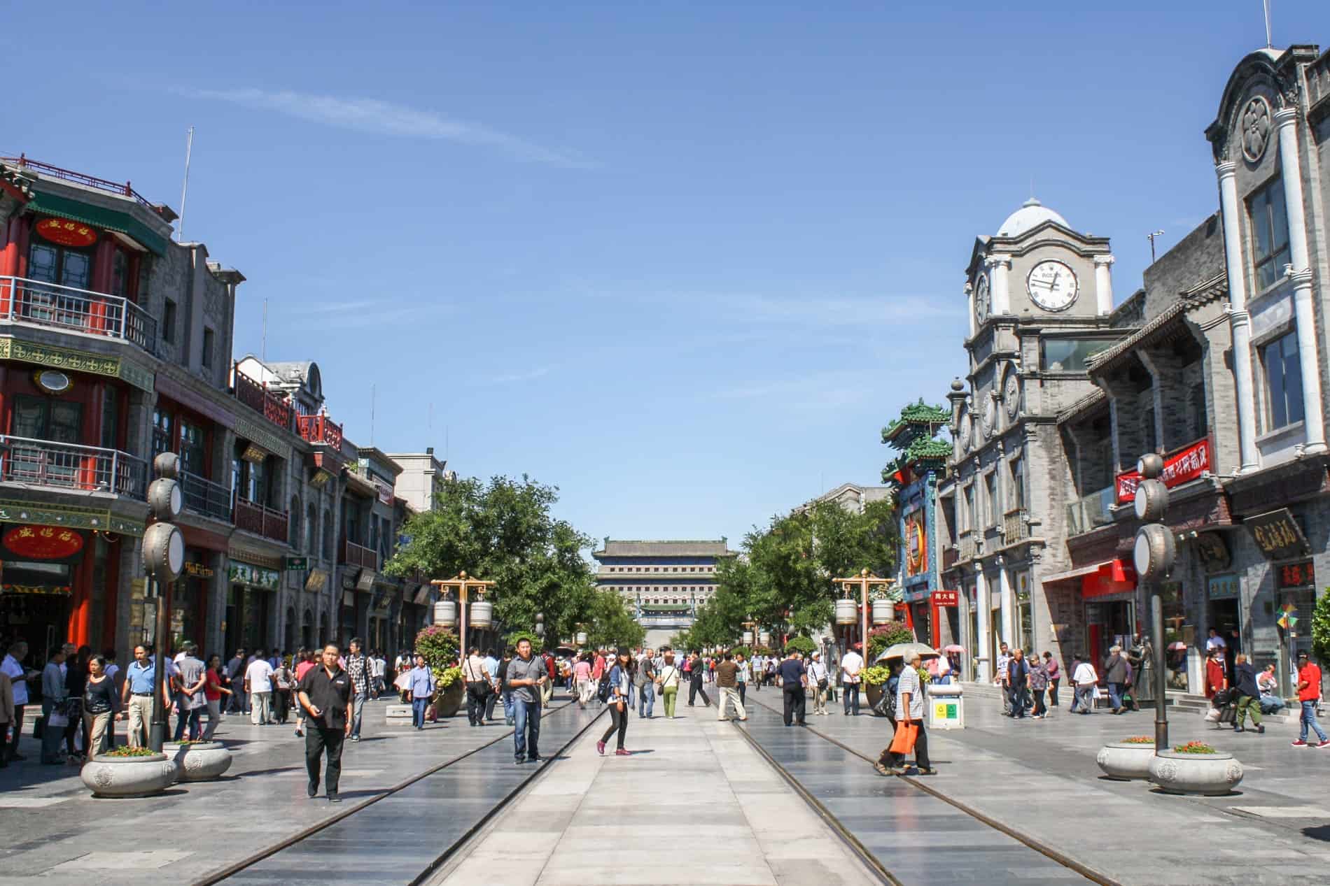 Crowd of people in the modern silver stone commercial area of Qianmen in Beijing. 