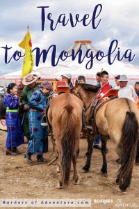 mongolia travel brochure Mongolians in traditional dress with their horses, outside a Ger at a cultural festival
