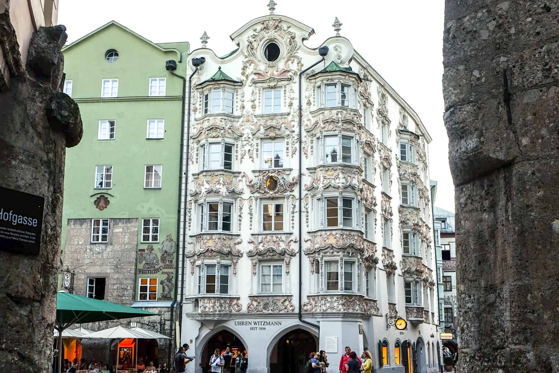 Ancient walls of a doorway looking towards the baroque building, Helbling Haus in Innsbruck in Austria