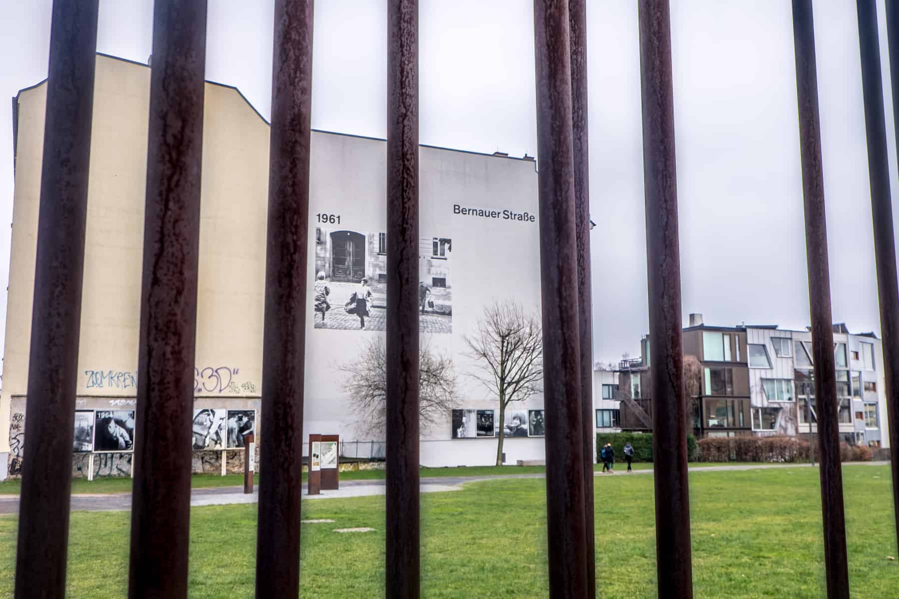 The rusty red coloured metal bars mark where the Berlin Wall once stood and are now part of the Berlin Wall Memorial at Bernauer Strasse