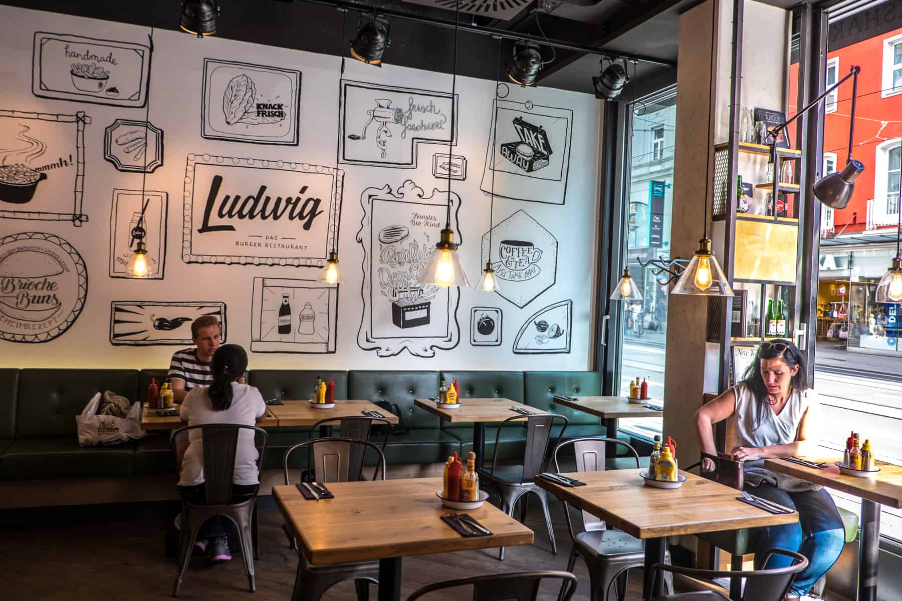 The modern wood and white walled interior of Ludwig restaurant in Innsbruck