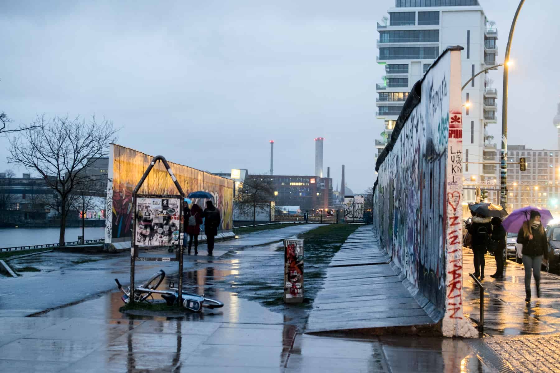 The space between two sections of the Berlin Wall at the East Side Gallery, in the evening rain