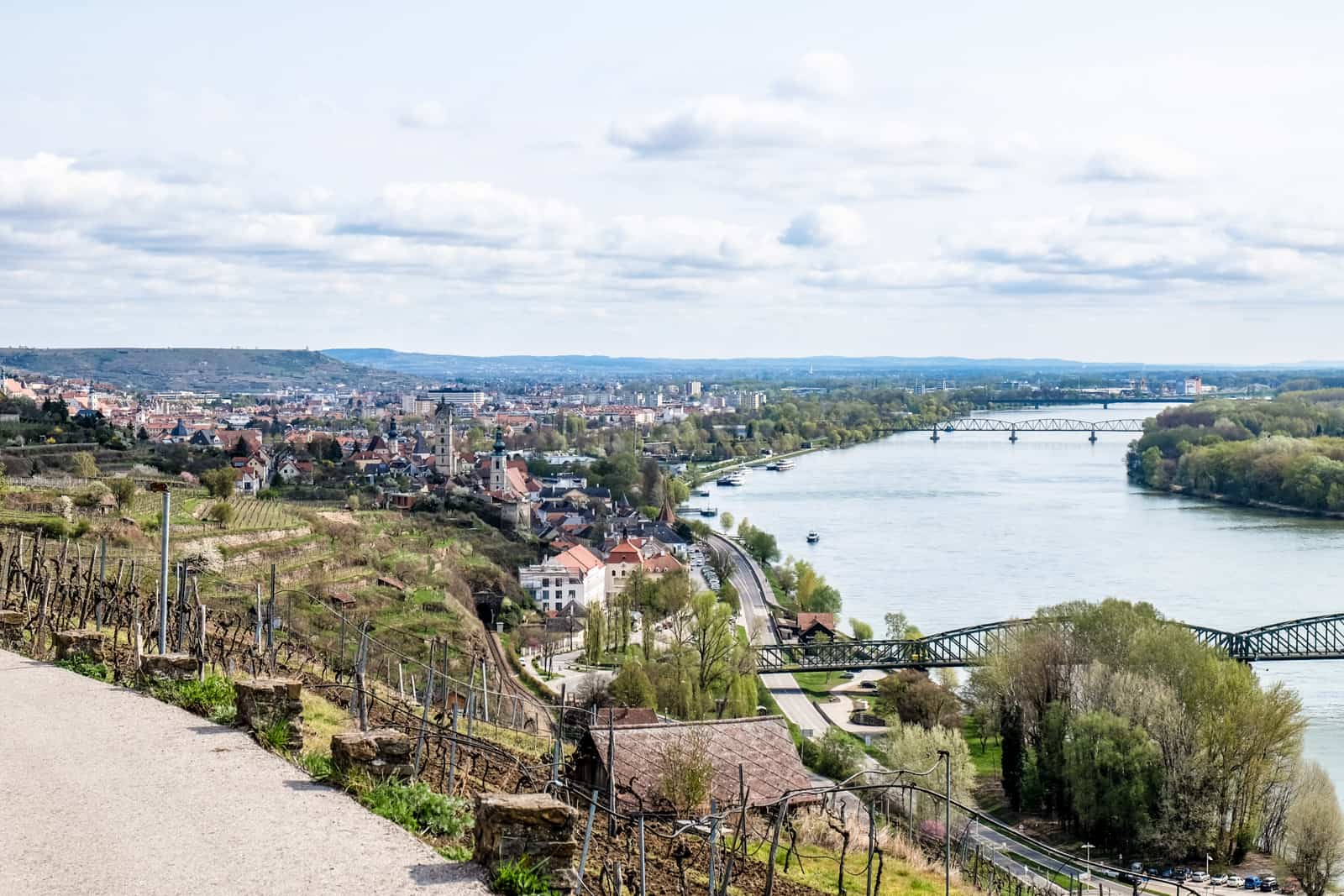 A faraway view from a hiking trail in the Wachau Valley of Krems city on the left and the Danube River on the right