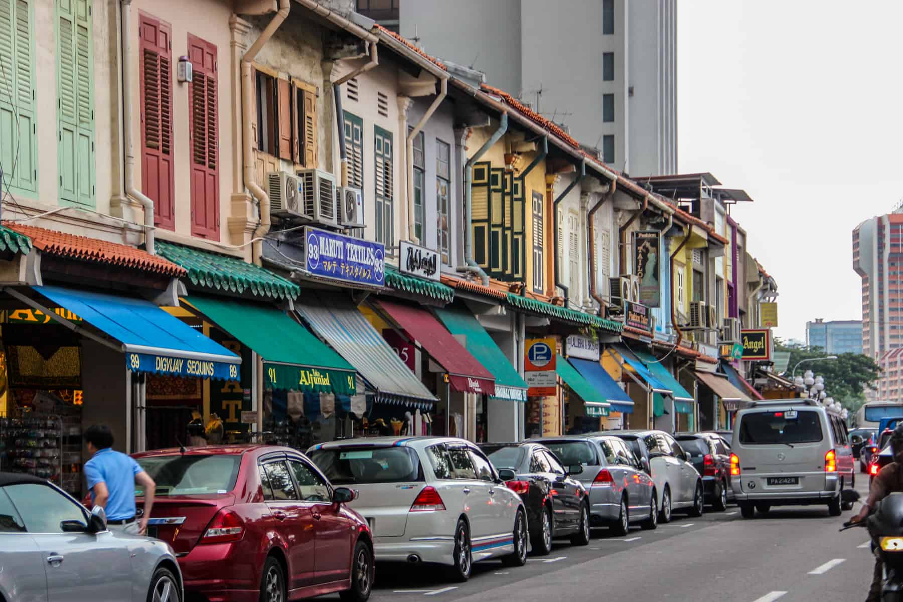 The wooden shutters and multicoloured facades of the famed shopfronts in Singapore city