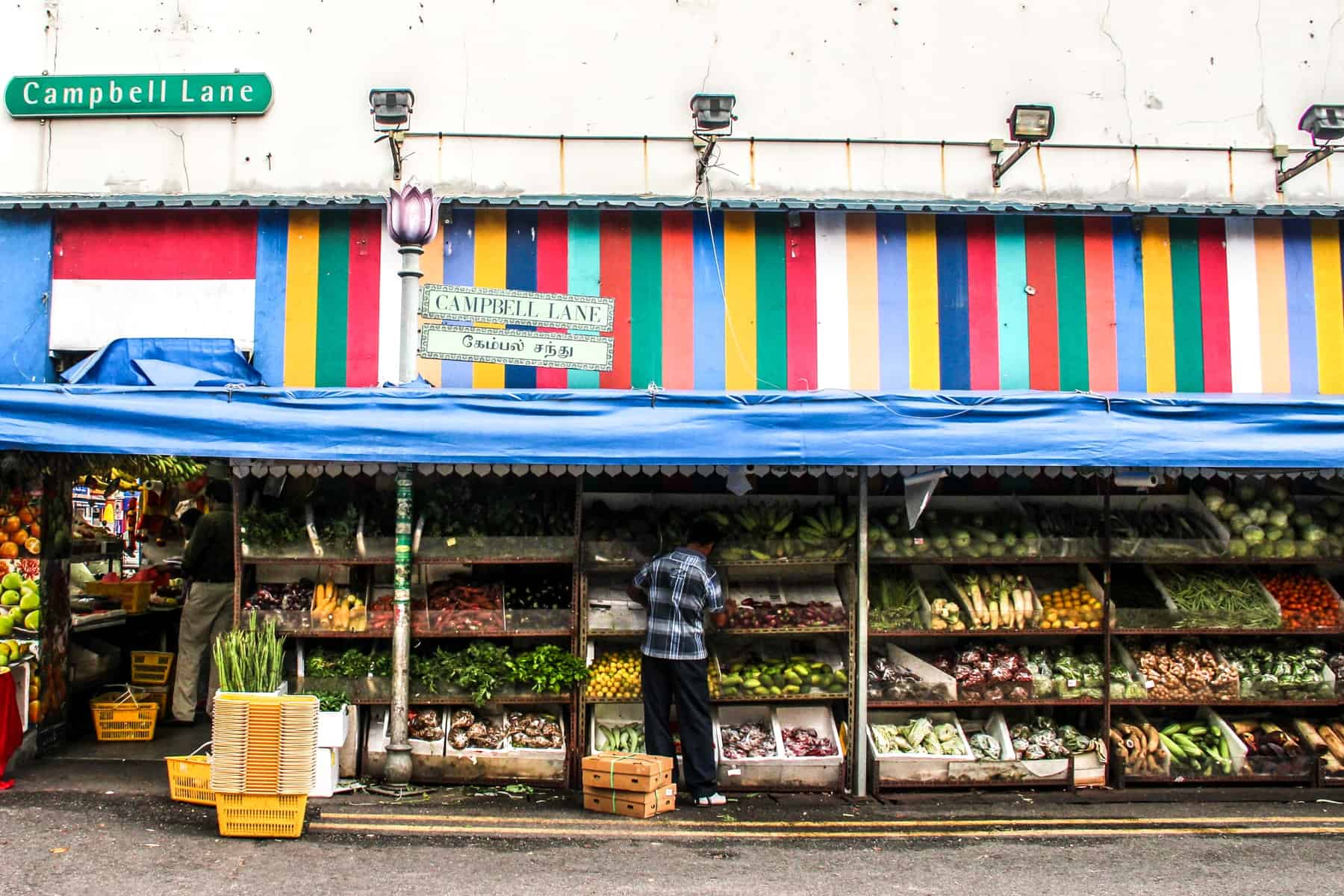 A large fruit stall lines the famous Campbell Lane whose wall is painted in Rainbow Stripes. It is found in Little India in Singapore