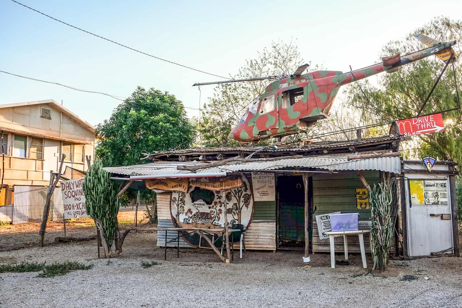 An empty helicopter on top of a metal shack in Daly Waters in the Australian Outback. 