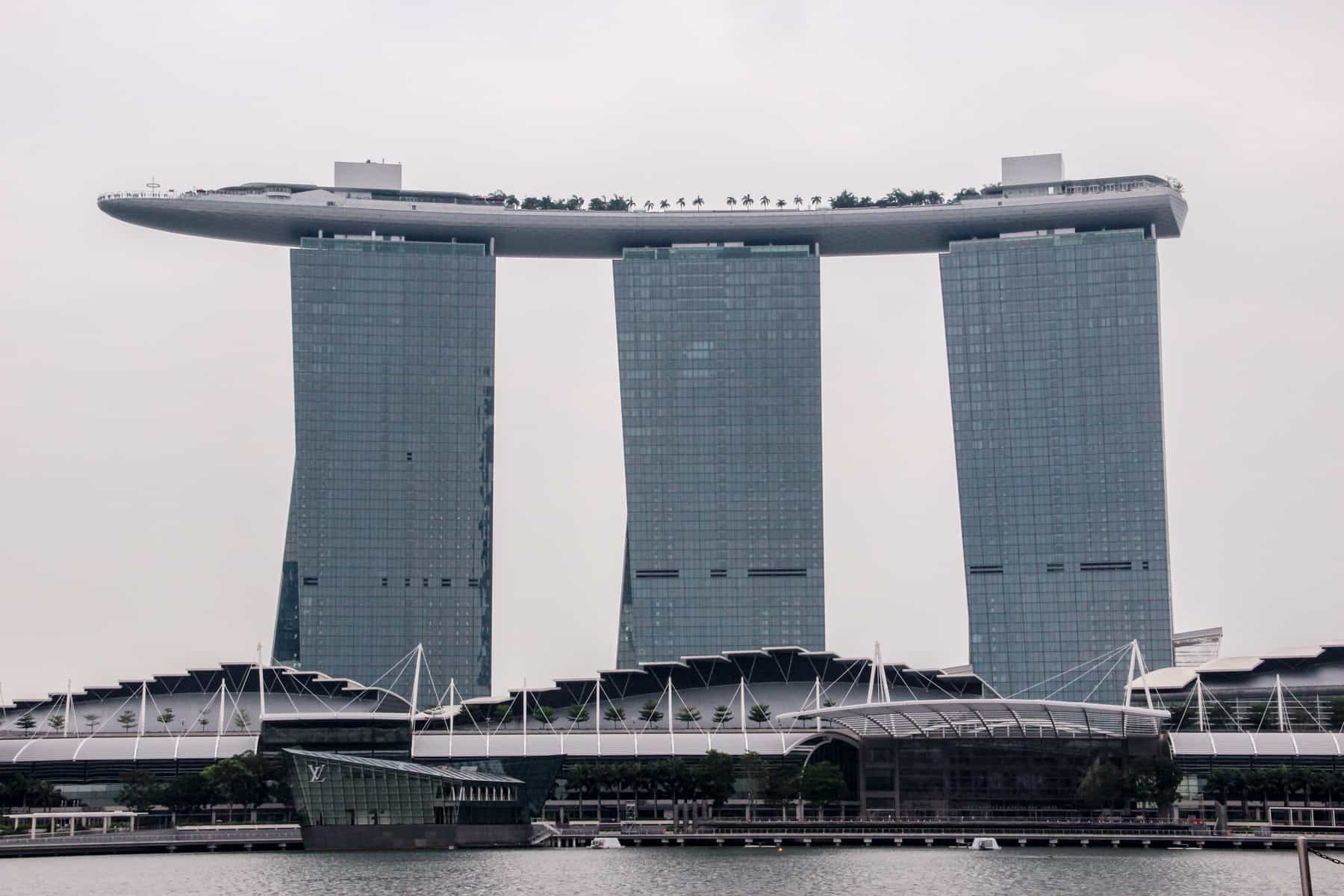 The Marina Bays Sands Hotel in Singapore, shaped like a boat resting on three towers
