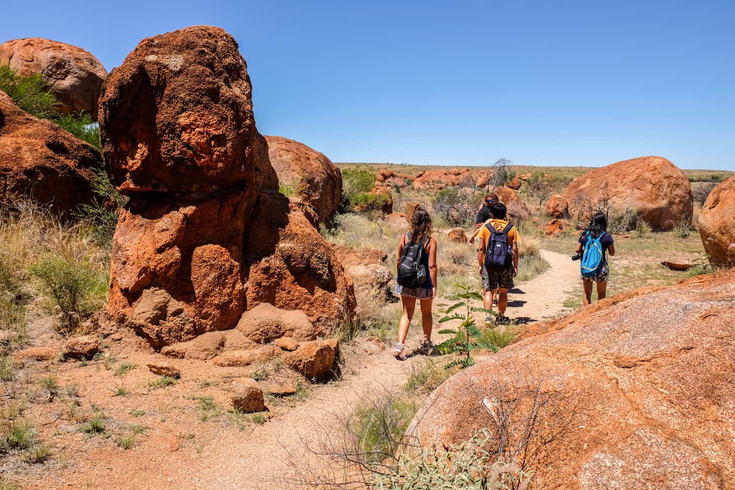 Travellers visiting the Karlu Karlu Devil's Marbles site near Alice Springs. 
