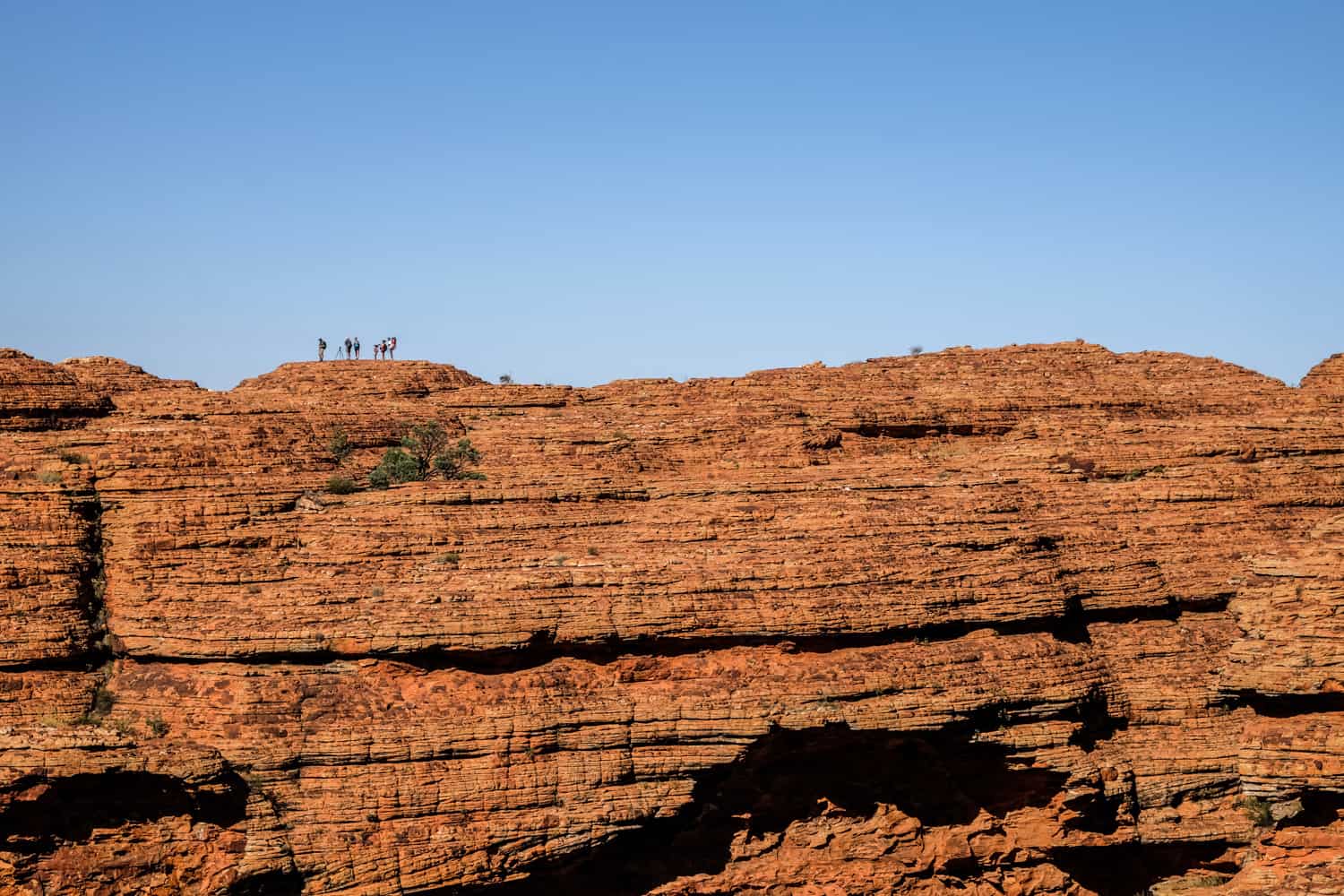 People standing on top of a ridge at the King's Canyon, NT Australia. 