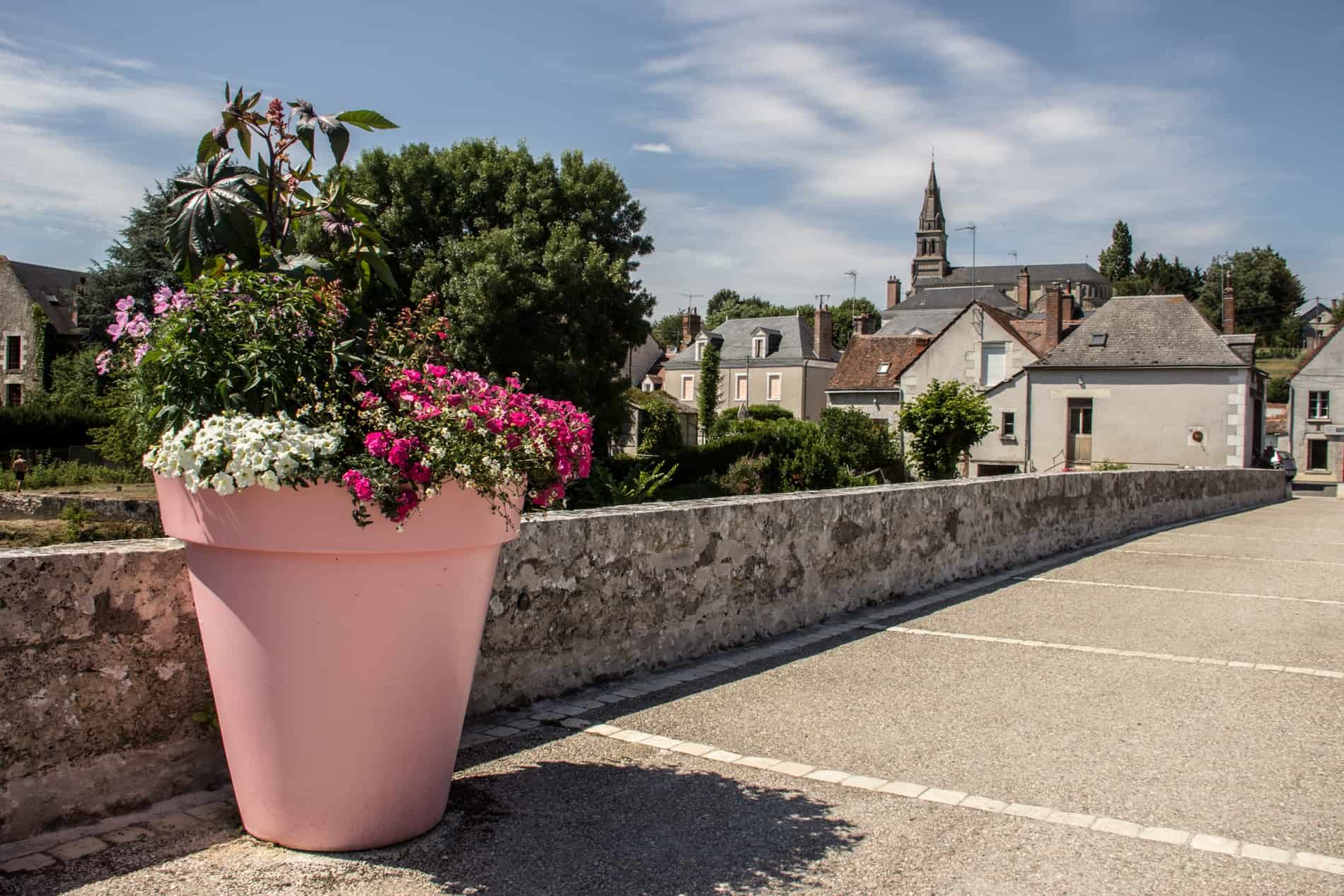 A giant pink plant pot on the bridge of French village of Candé Sur Beauvron in the Loire Valley. 