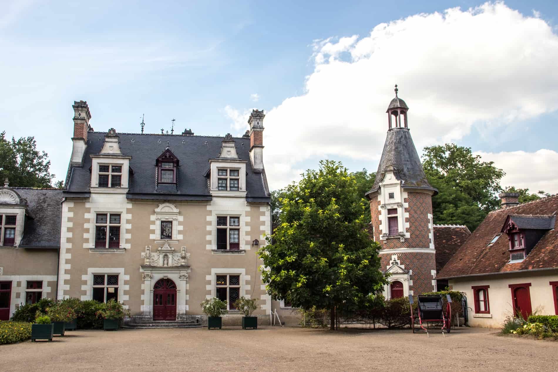 The mocha and red spire structures of the Chateau de Troussay Cheverny, Loire Valley.