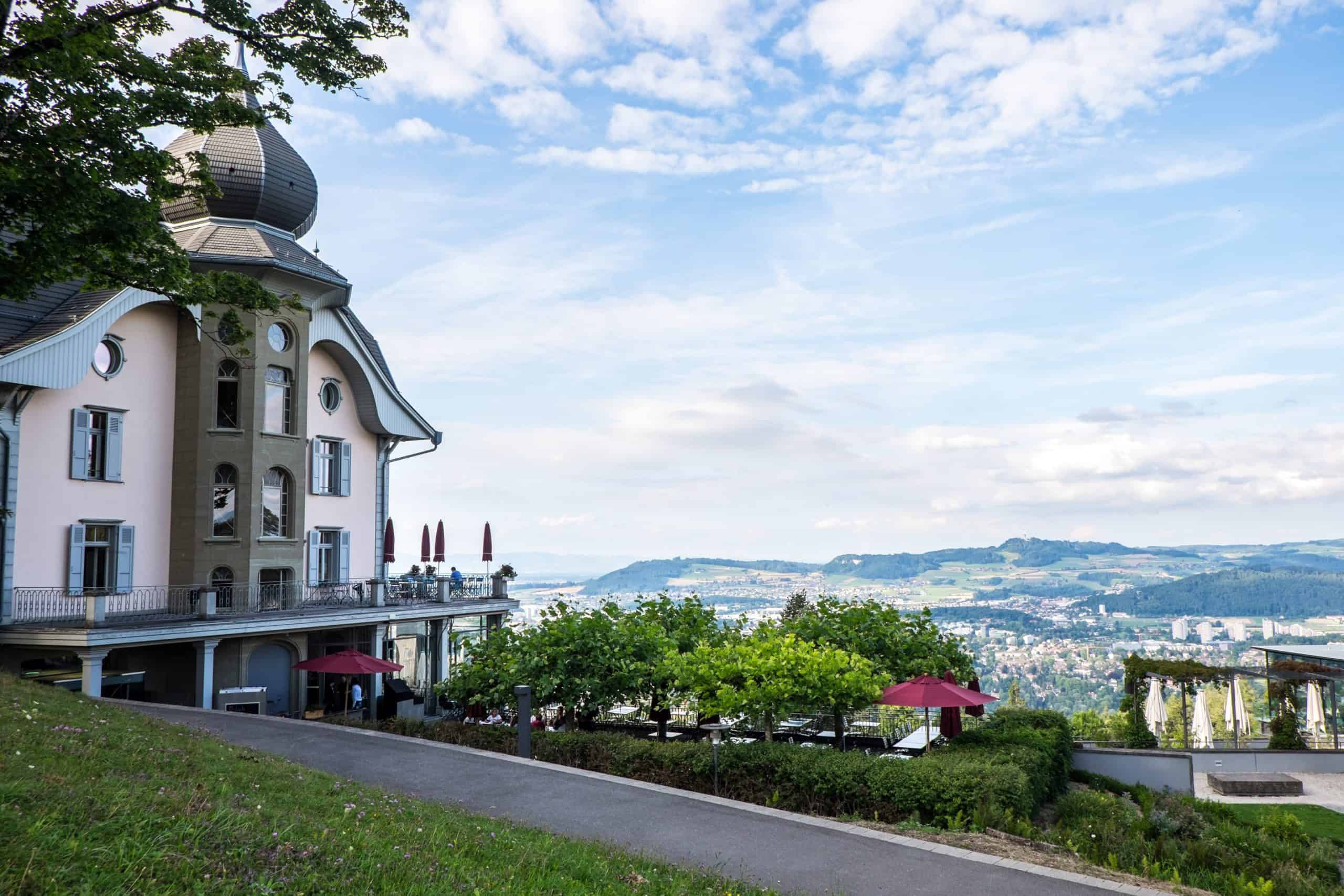 City views from pink and blue pastel building of the Gurtners restaurant on Gurten Peak in Bern