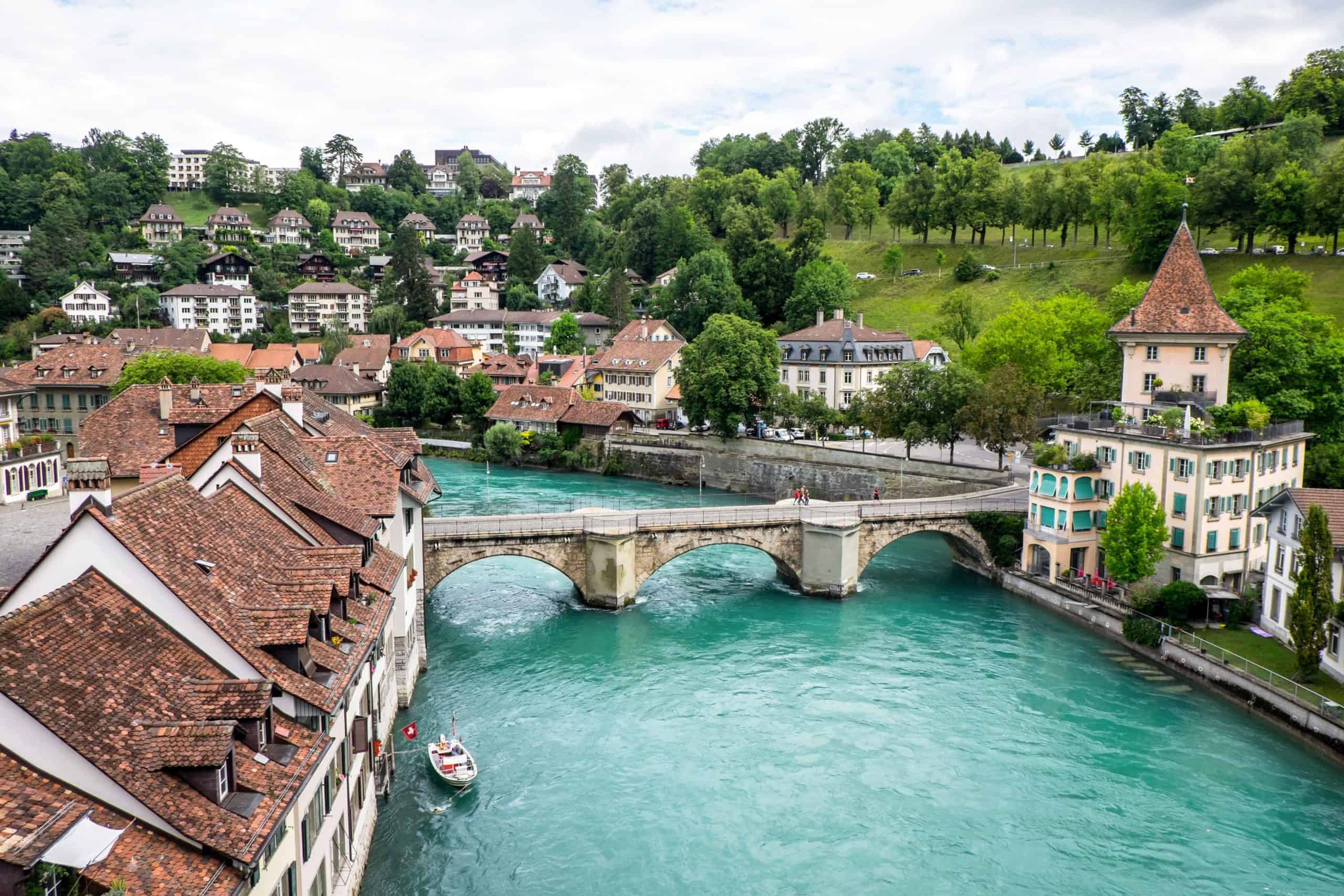 Elevated view of red-roofed Bern Old town and the aqua Aare River flowing through it in Switzerland