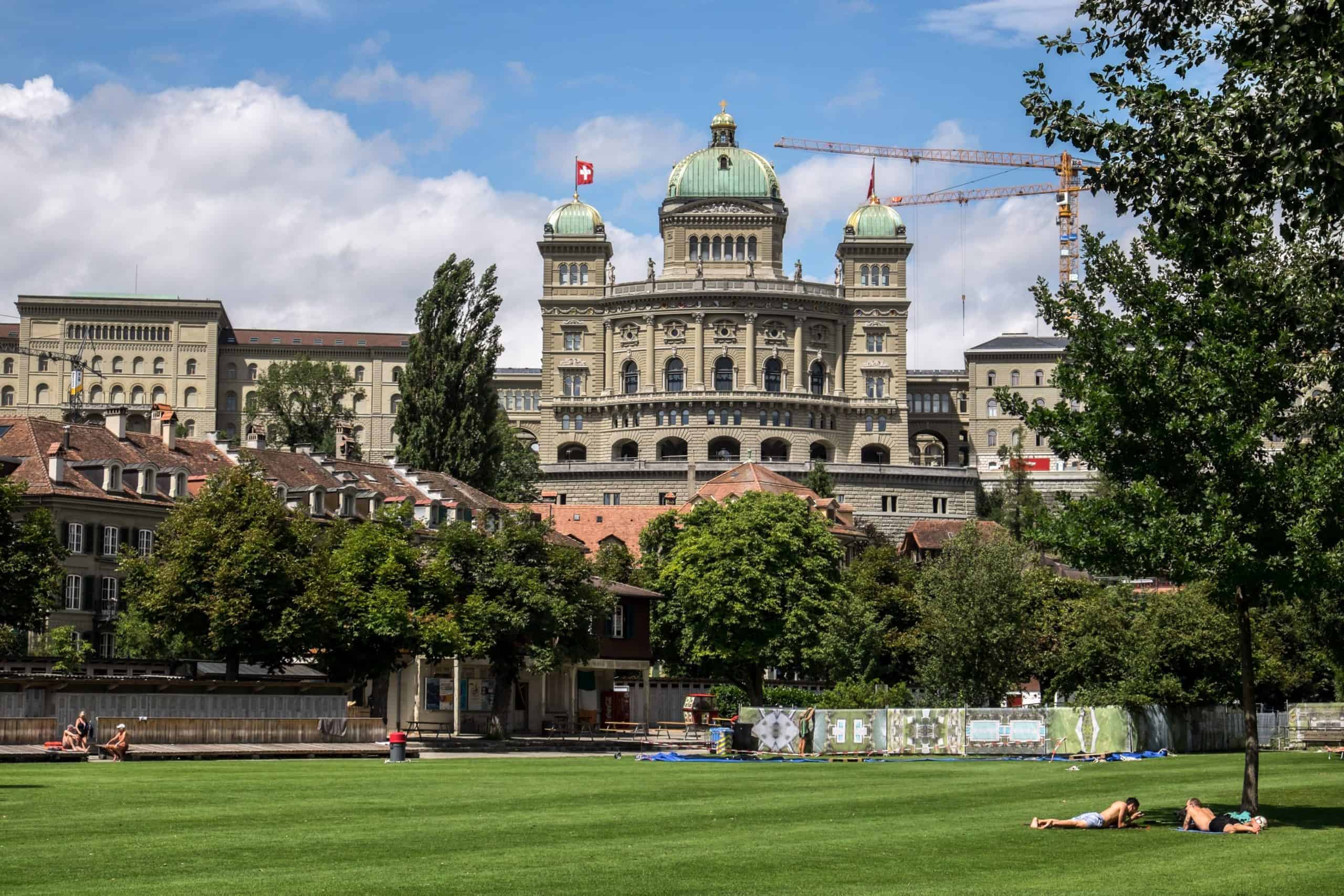 View of Federal Palace of Switzerland Parliament building in Bern, seen from Aare Riverside park