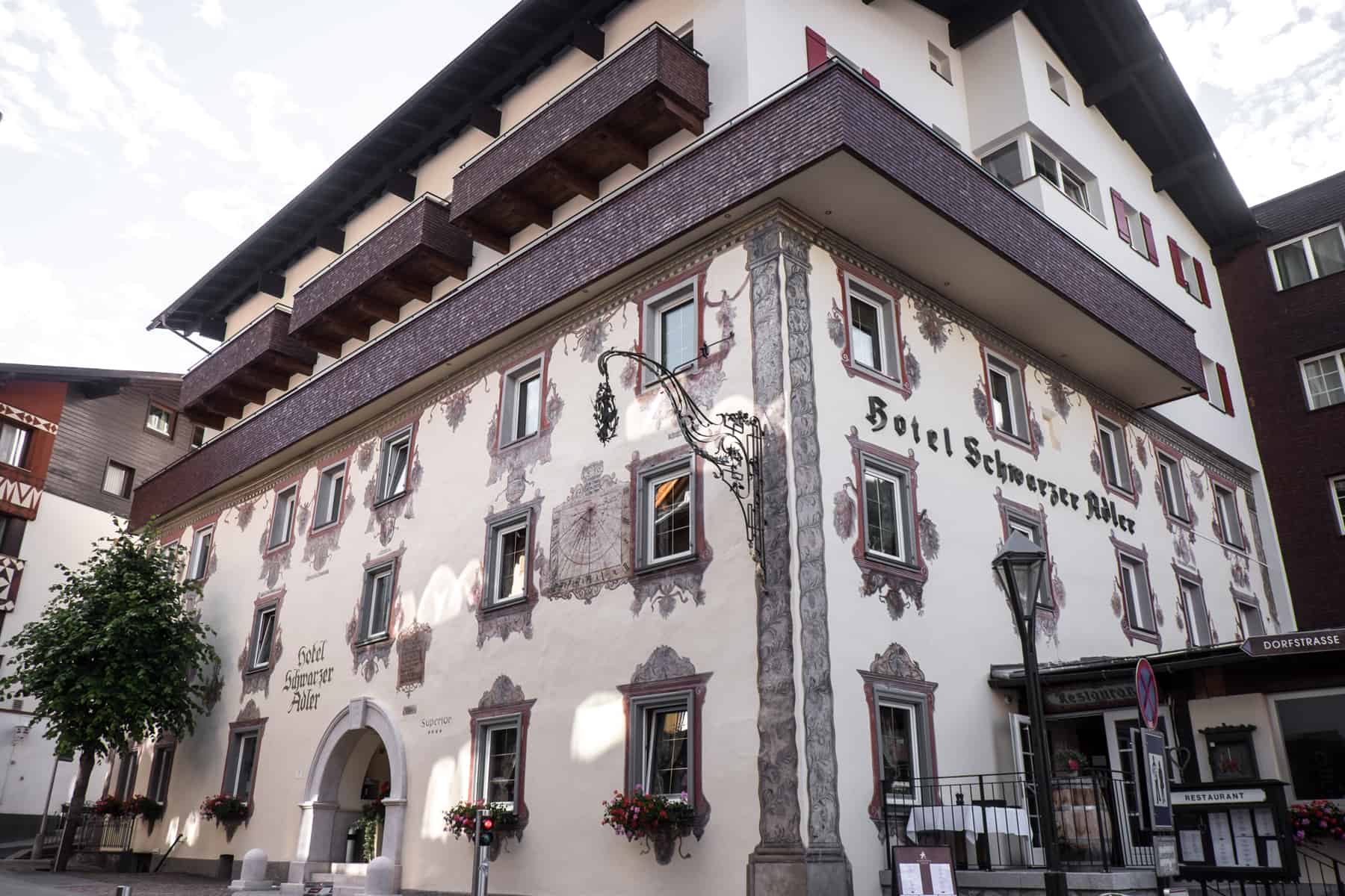 Deep red Austrian painting in traditional style on the Hotel Schwarzer Adler St Anton am Arlberg