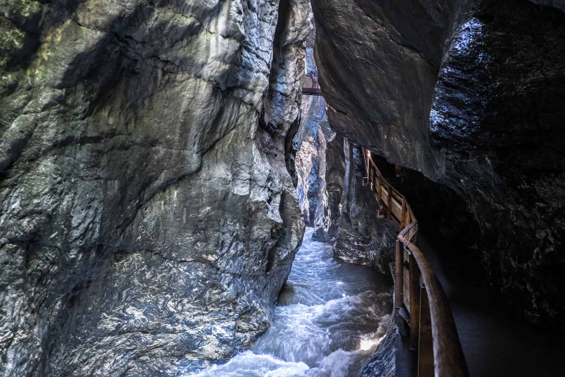 White water gushes through the narrow silvery green rock walls of Liechtensteinklamm in Austria