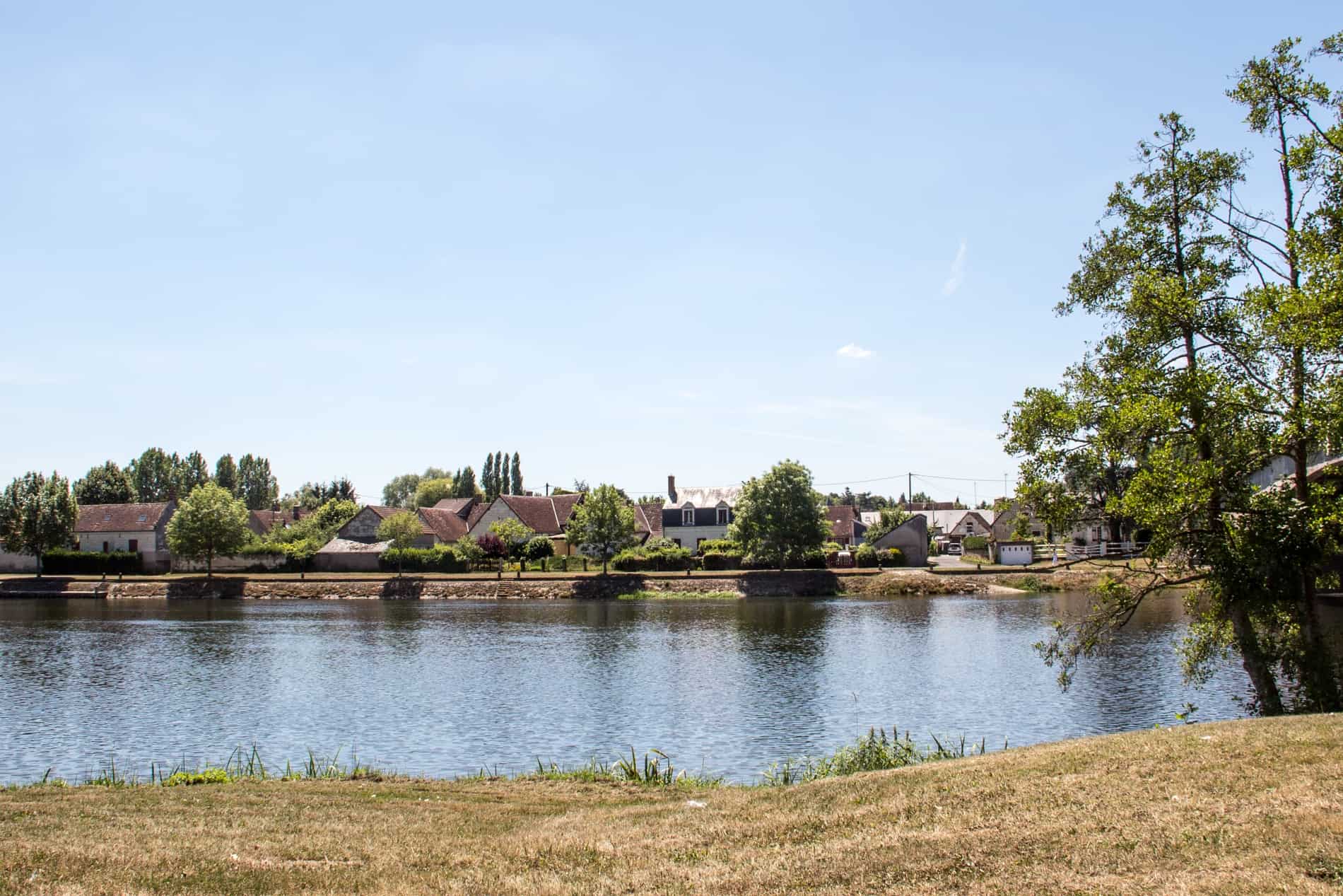 A riverside village seen from a Loire Valley Cycling path in France. 