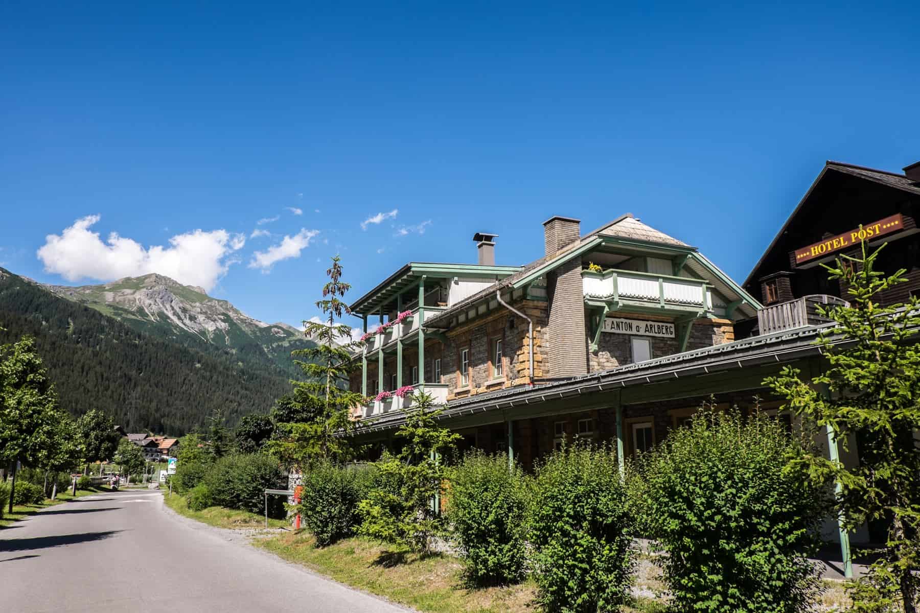 The triangular roofed and green painted train station St Anton am Arlberg