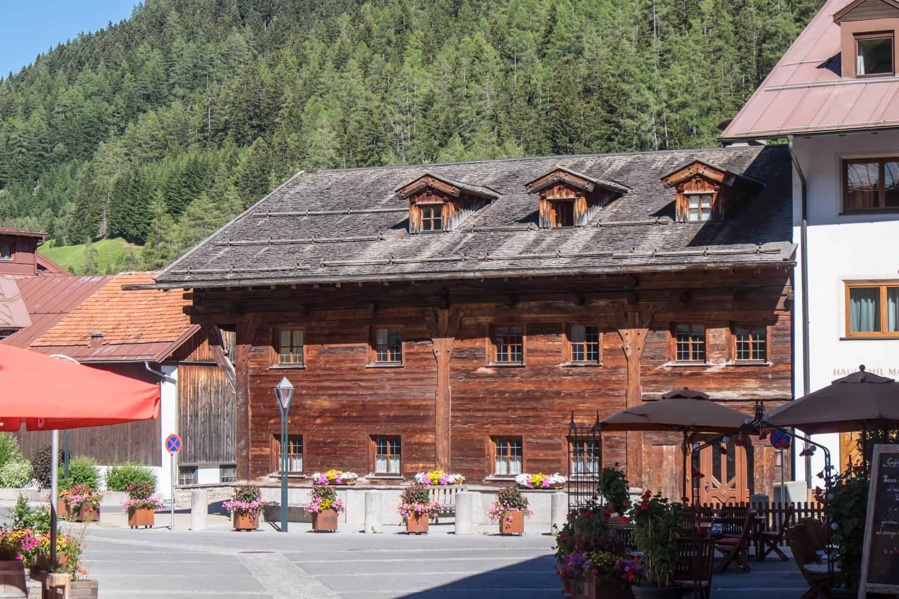A long golden wood, traditional house that's the oldest house in St. Anton in Austria