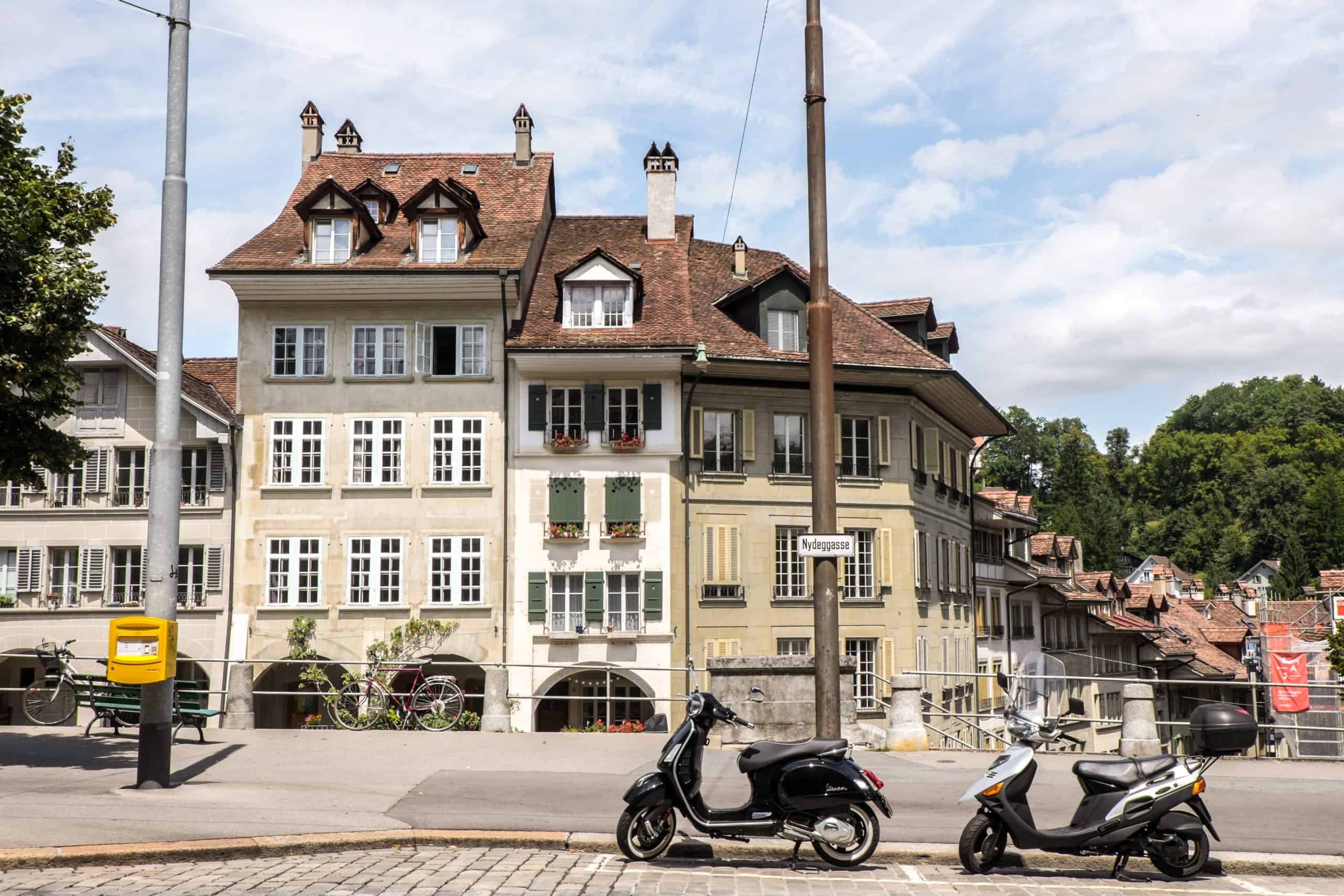 Caramel and coffee coloured houses with traditional red roofs in Bern - the capital of Switzerland