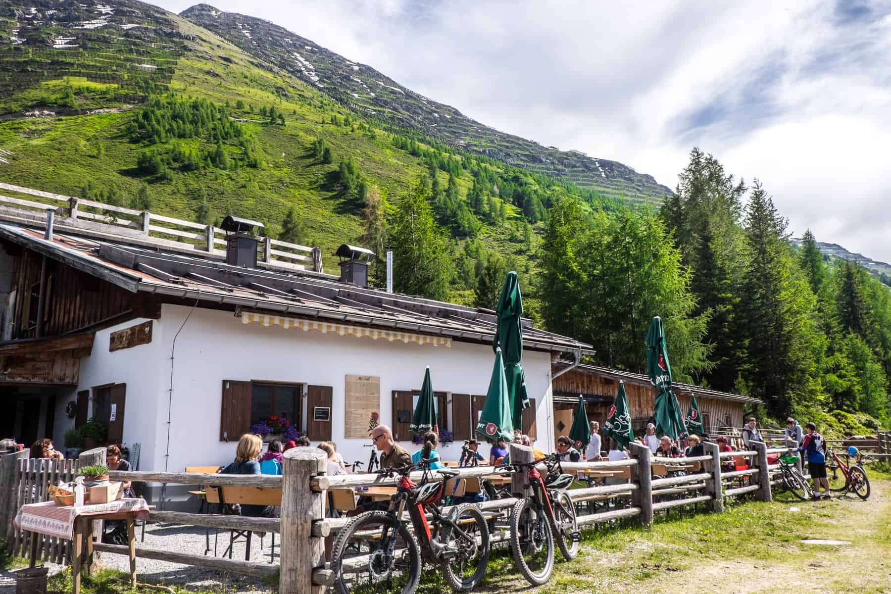 The mountain hut set within green forest called the Rendlalm in St Anton am Arlberg