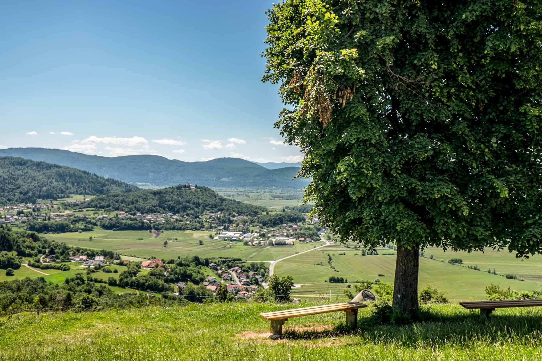 View from the top of St. Ana Hill at Podpec Lake, Slovenia, with a sweeping viewpoint of the Ljubljana marshes. 