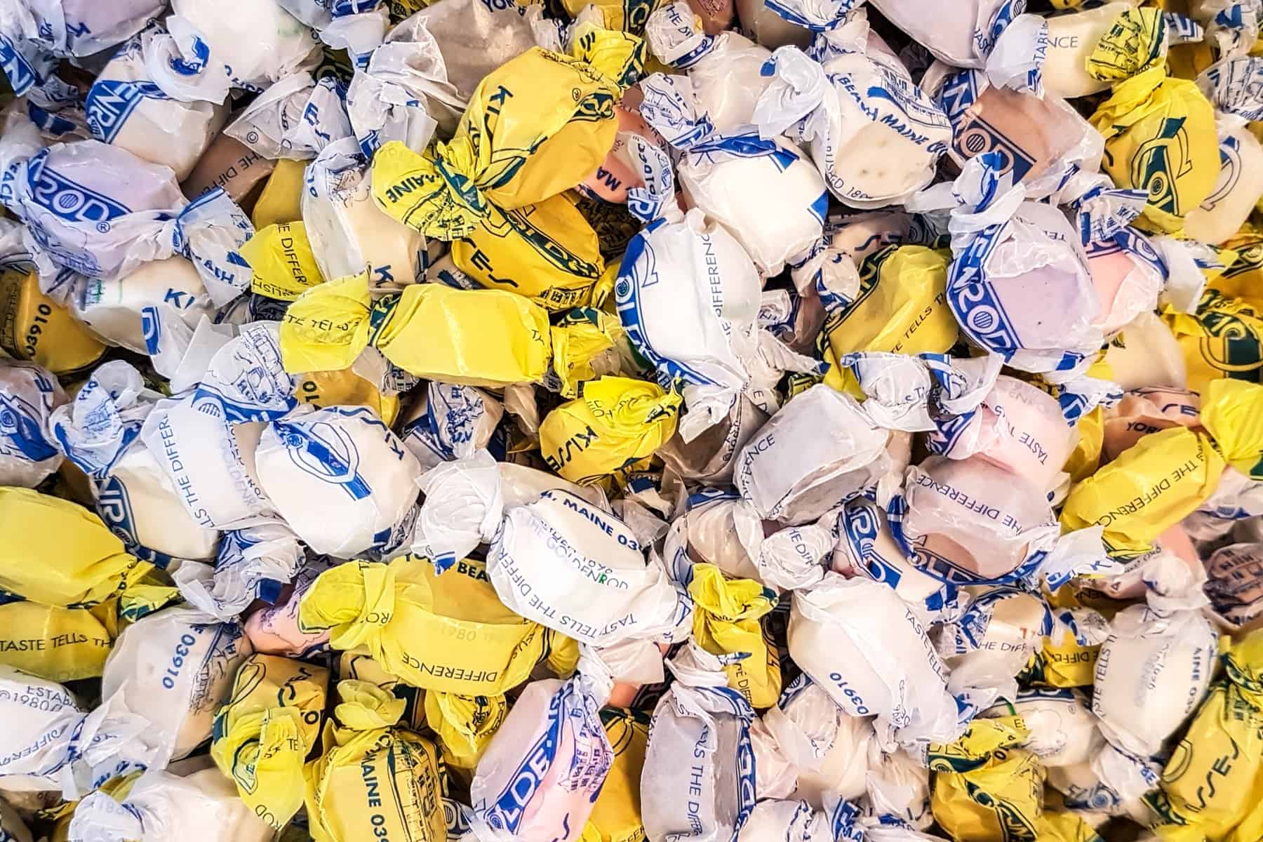 Saltwater taffy from Maine, distinguishable by their white and yellow candy wrappers. 
