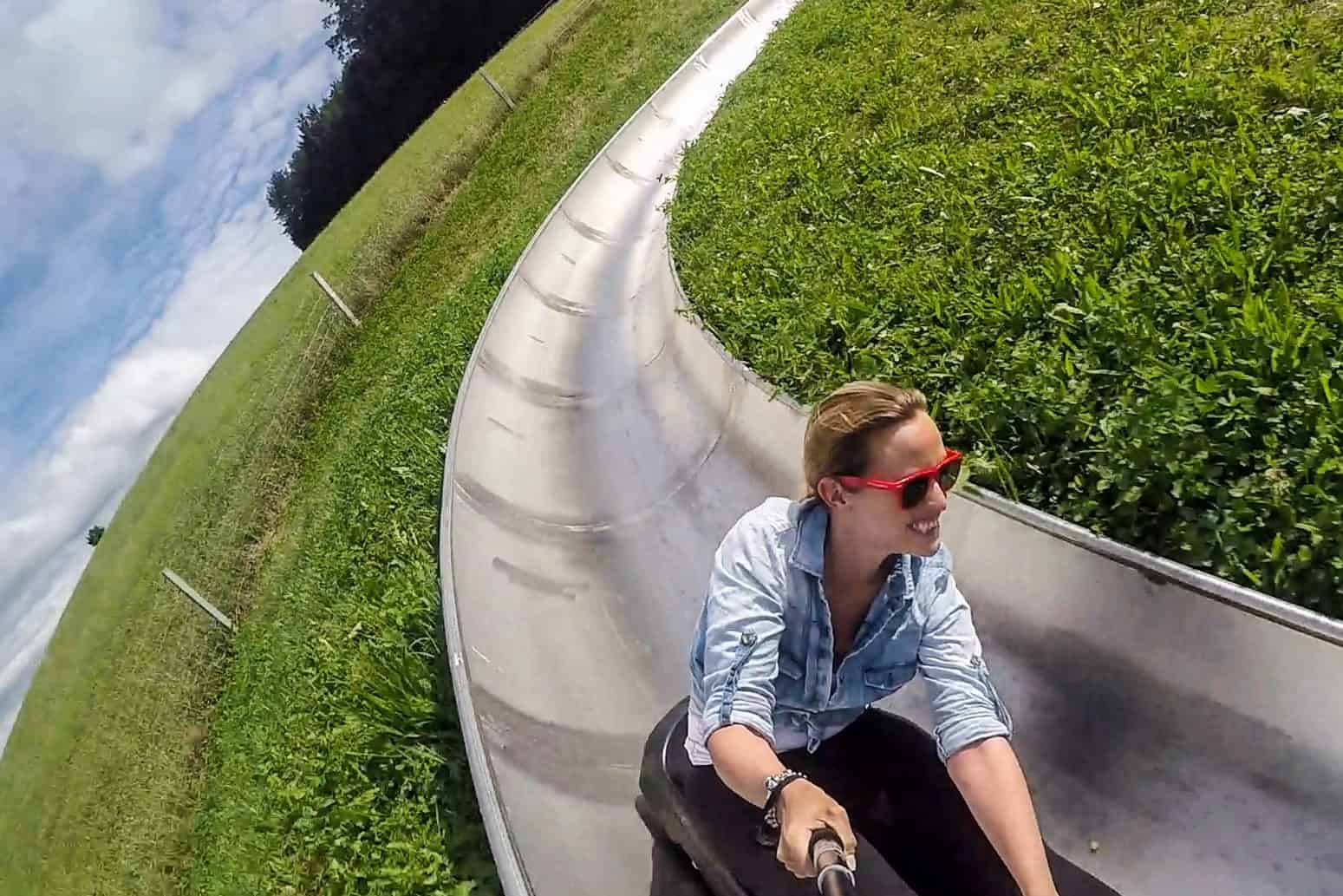 A woman rides the 500m long mountain toboggan on Gurten Peak, Bern, Switzerland