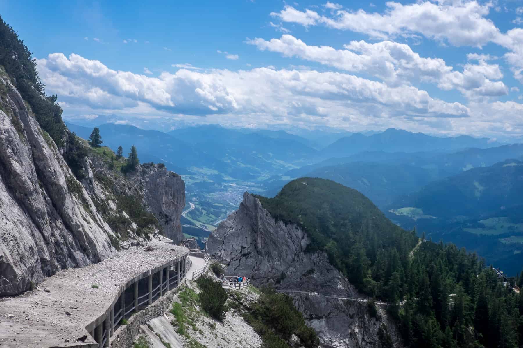 The vast valley view as seen from the elevated, rocky, limestone mountain entrance to the Eisriesenwelt cave in Austria