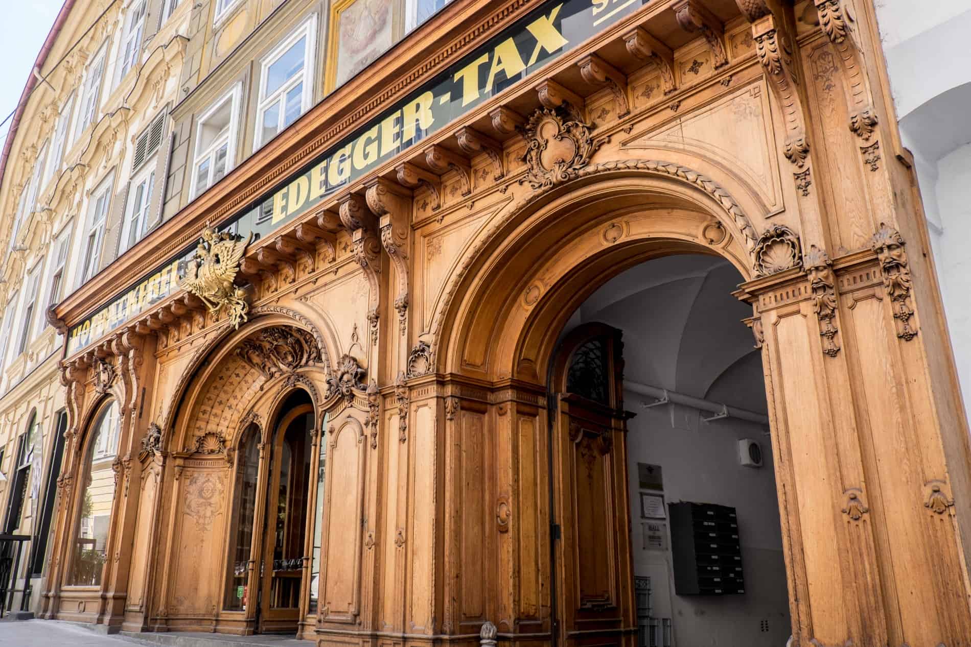 The wooden facade of the former Habsburg bakery called Hofbäckerei Edegger-Tax in Graz.