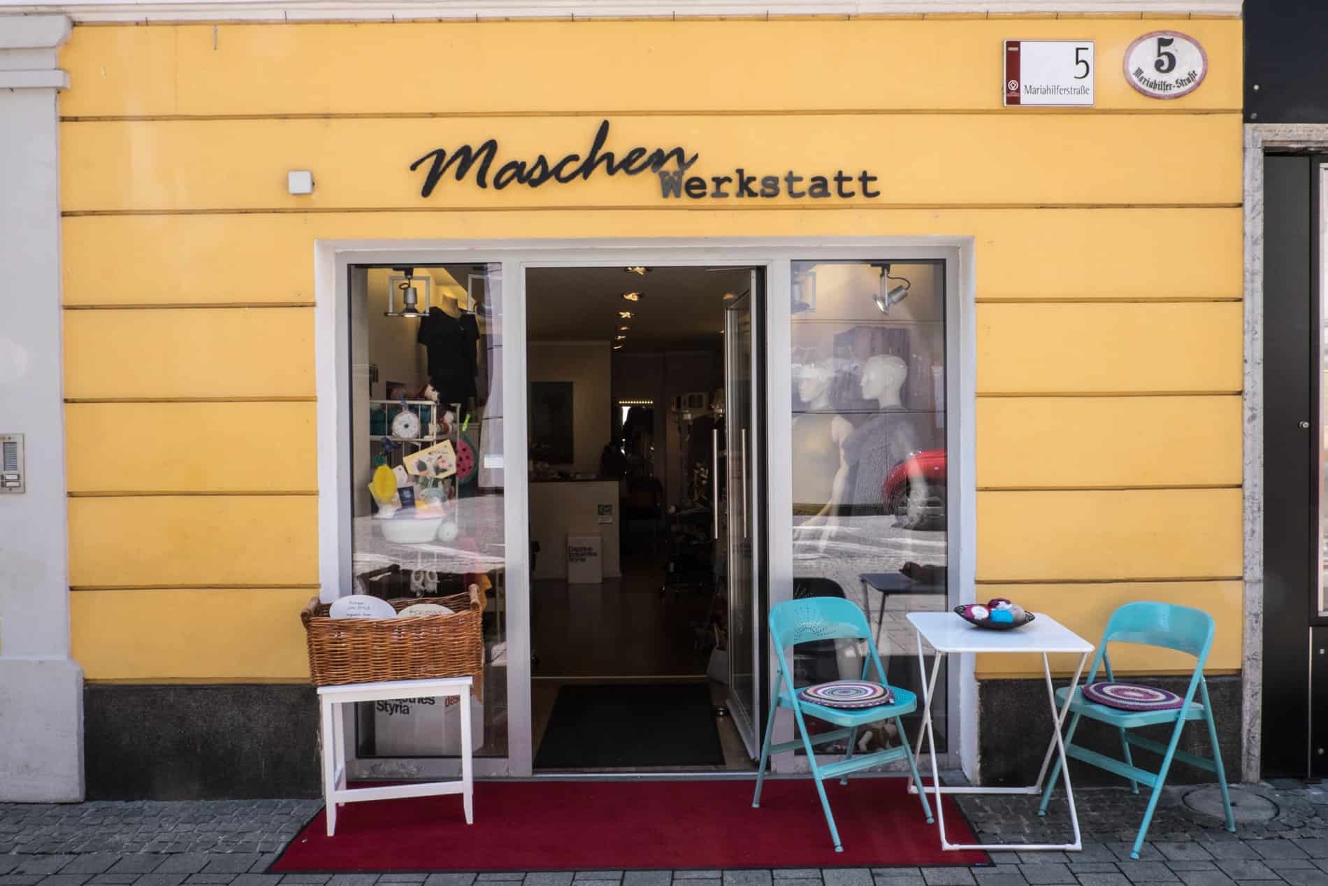 Yellow facade of design charity shop in Graz, Austria.