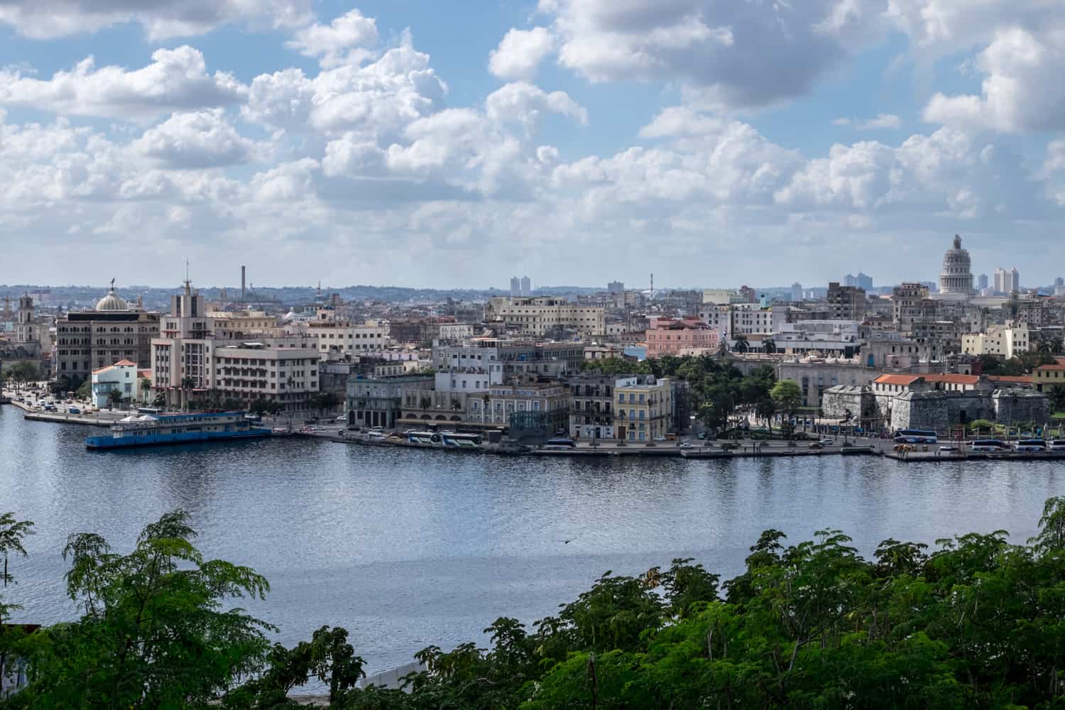 Elevated view over a bay of water to Havana city, Cuba. 