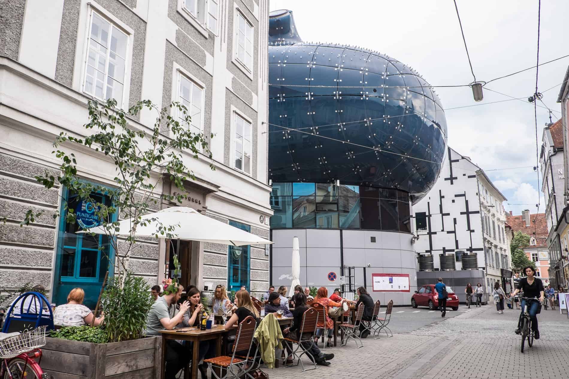 Street view of the back of the 'friendly alien' Kunsthaus modern art museum in Graz.